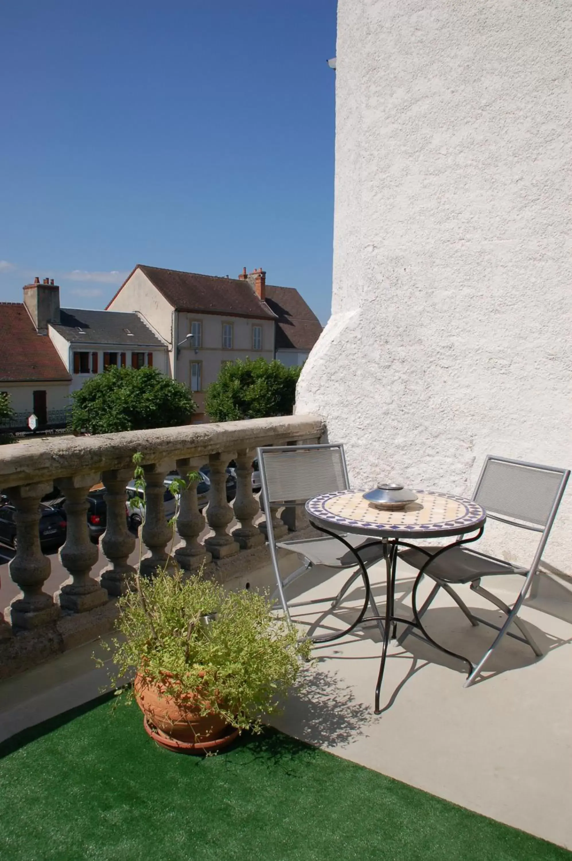 Patio in Logis Hotel La Tourelle du Beffroi