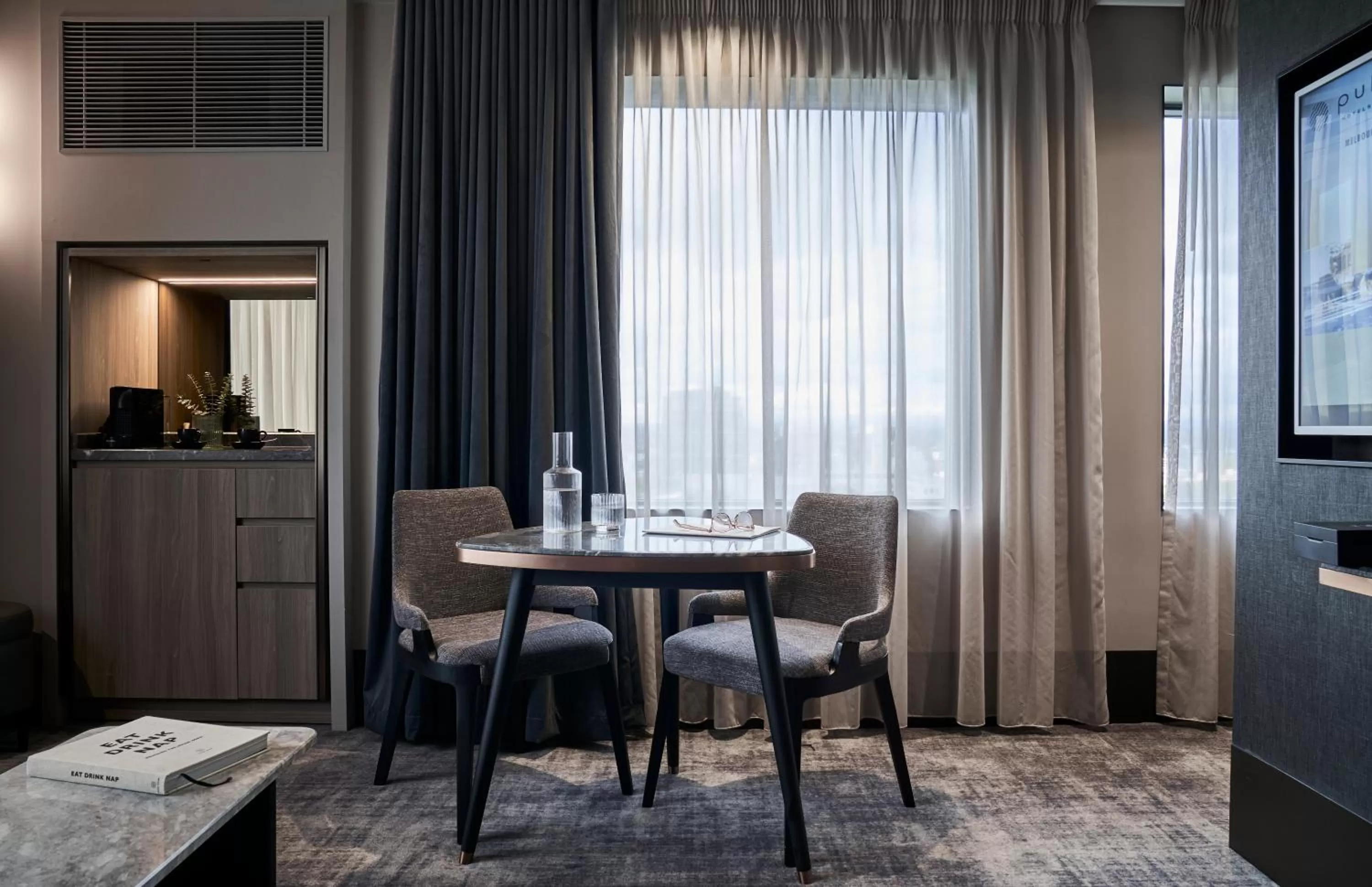 Communal lounge/ TV room in Pullman Melbourne On the Park