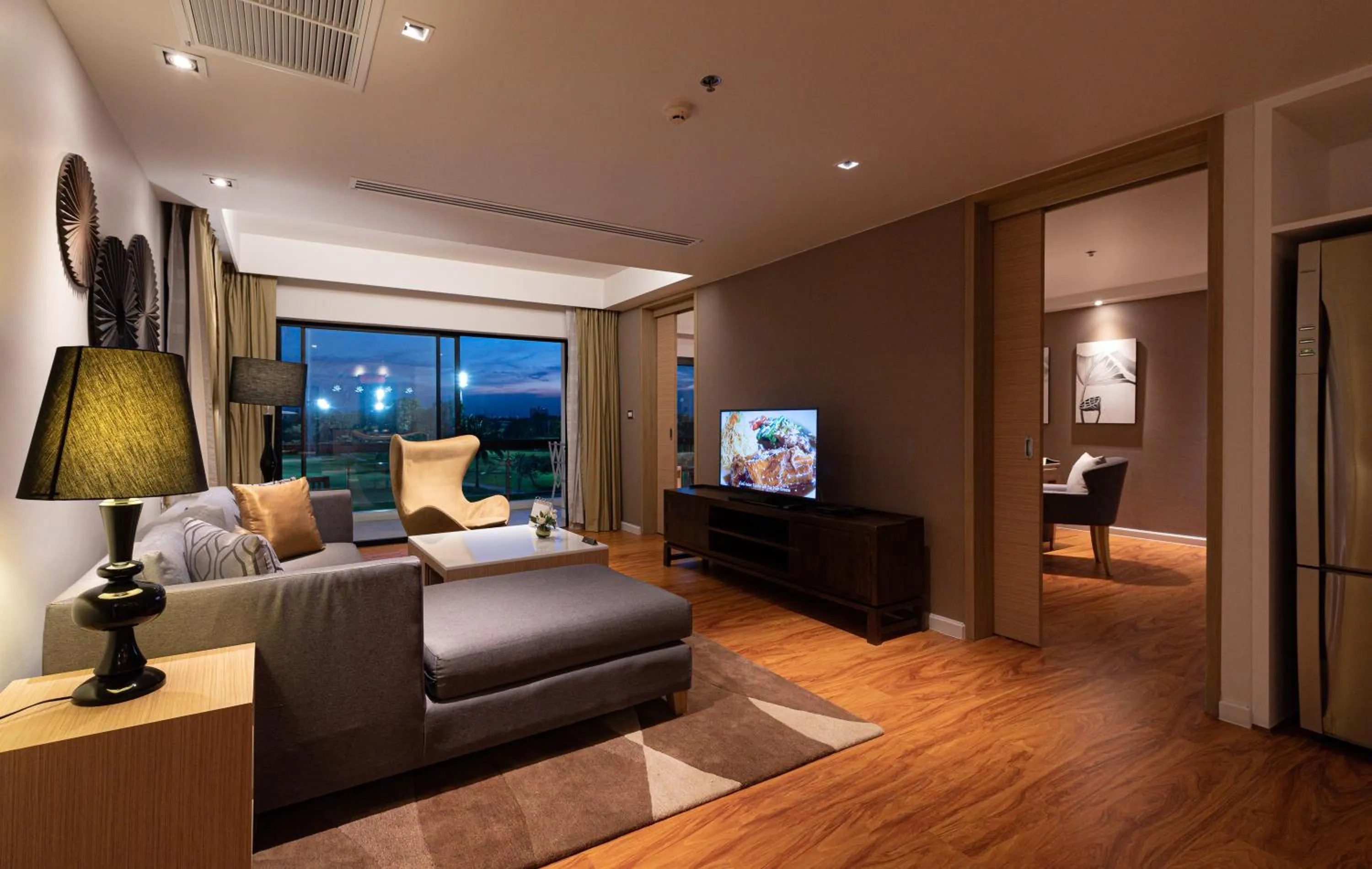 Living room in Summit Windmill Golf Suite Hotel at Suvarnabhumi