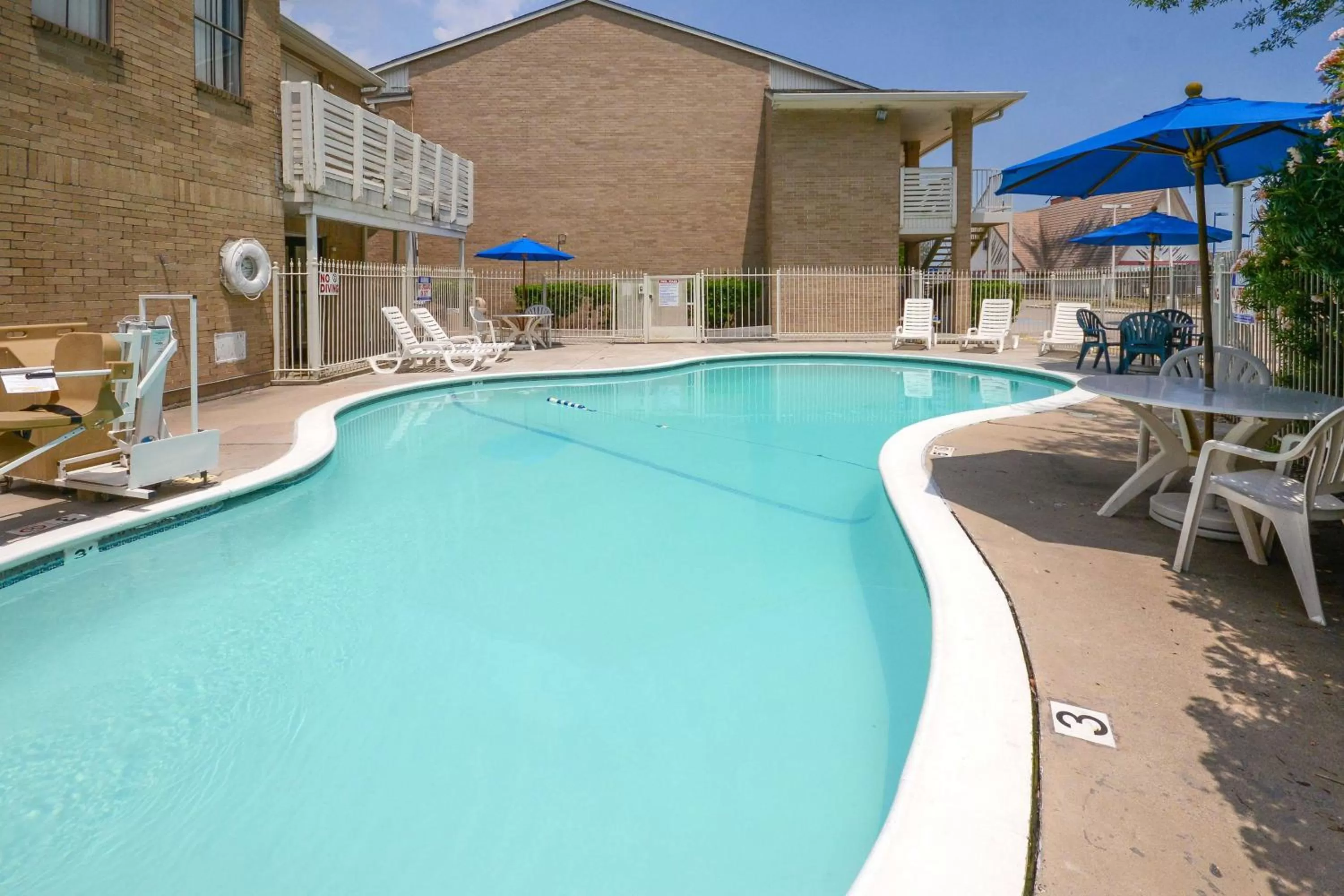 Pool view in Motel 6-Baytown, TX - Baytown East