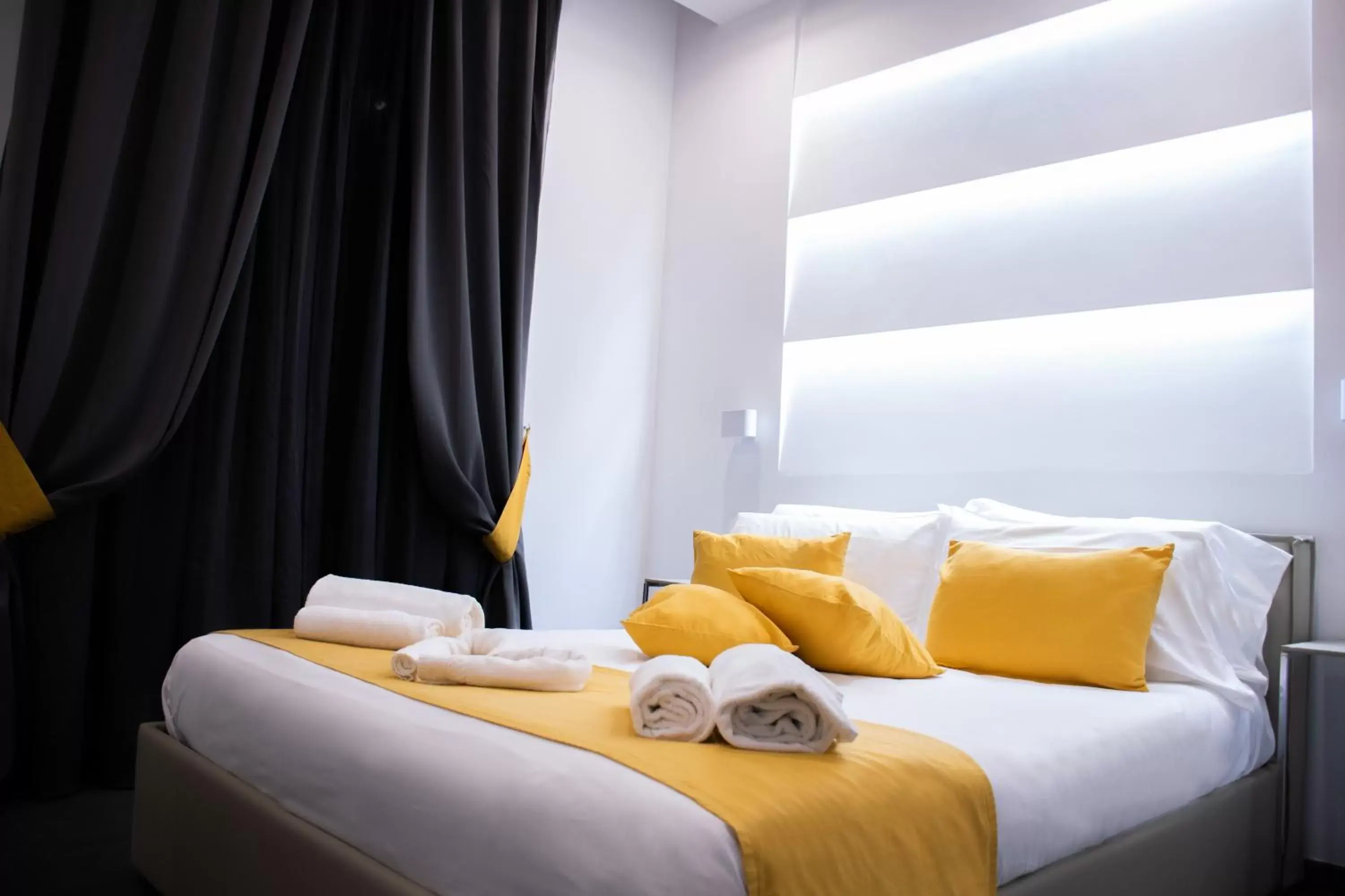 Bed in Megaris Luxury Suite Rooms