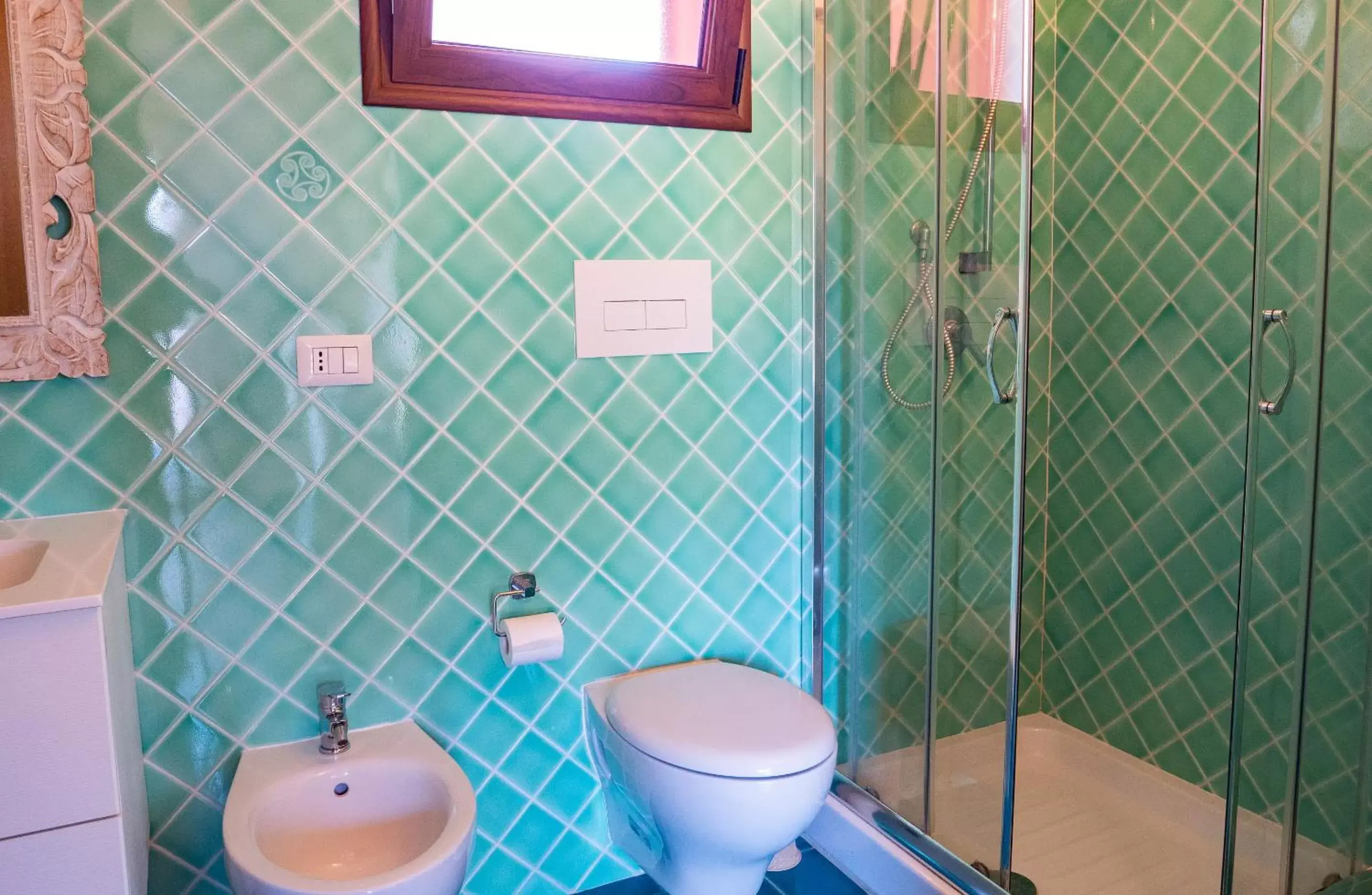 Bathroom in QUADRIFOGLIO Affittacamere
