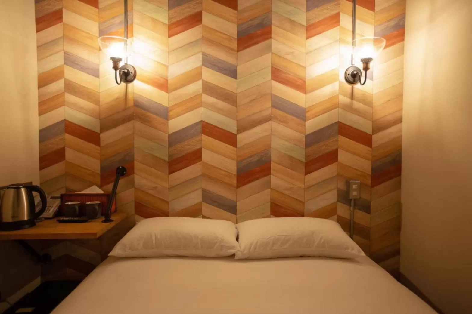 Bed in The Rooms Inn