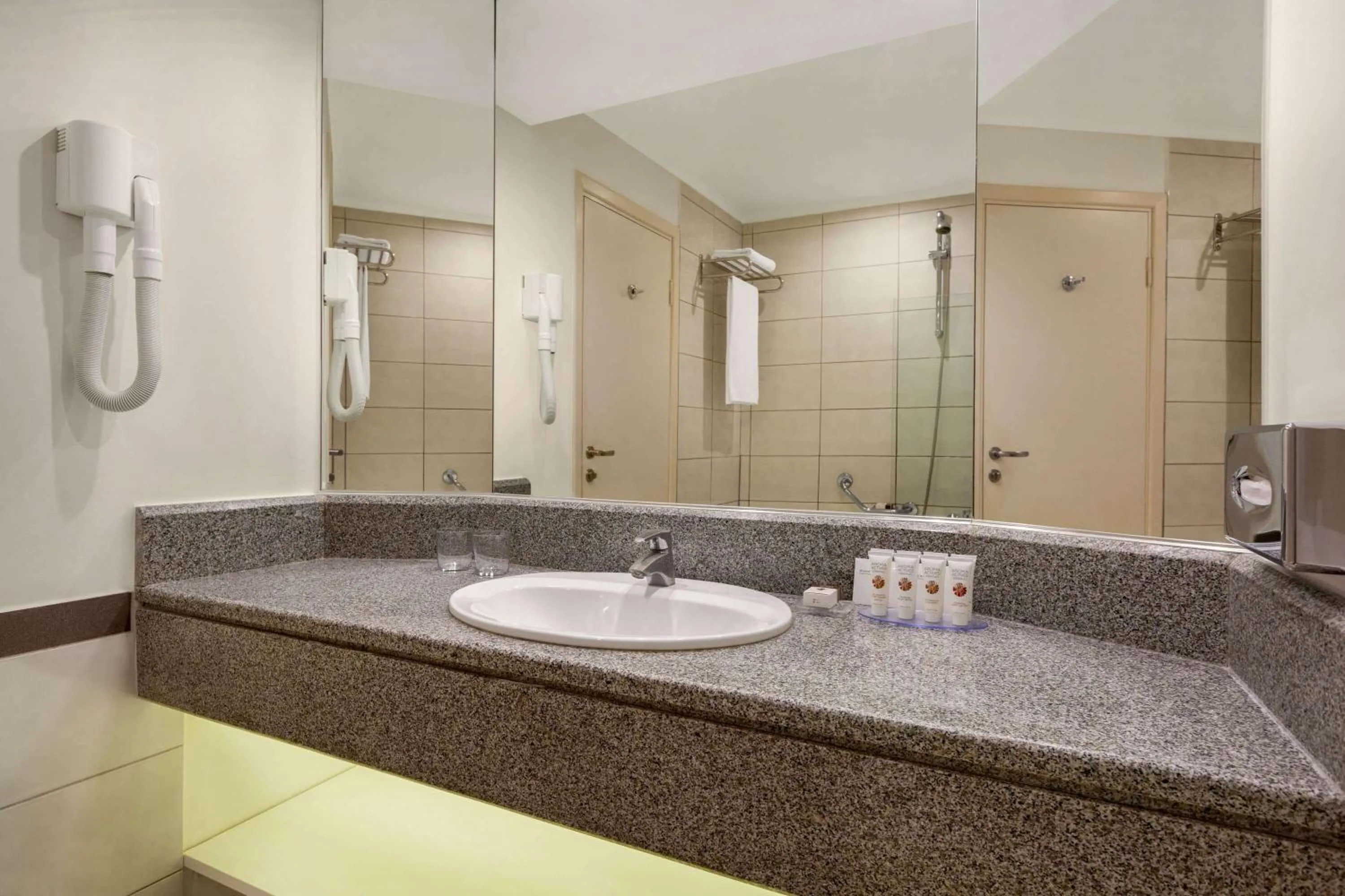 Bathroom in Ramada Plaza by Wyndham Thraki