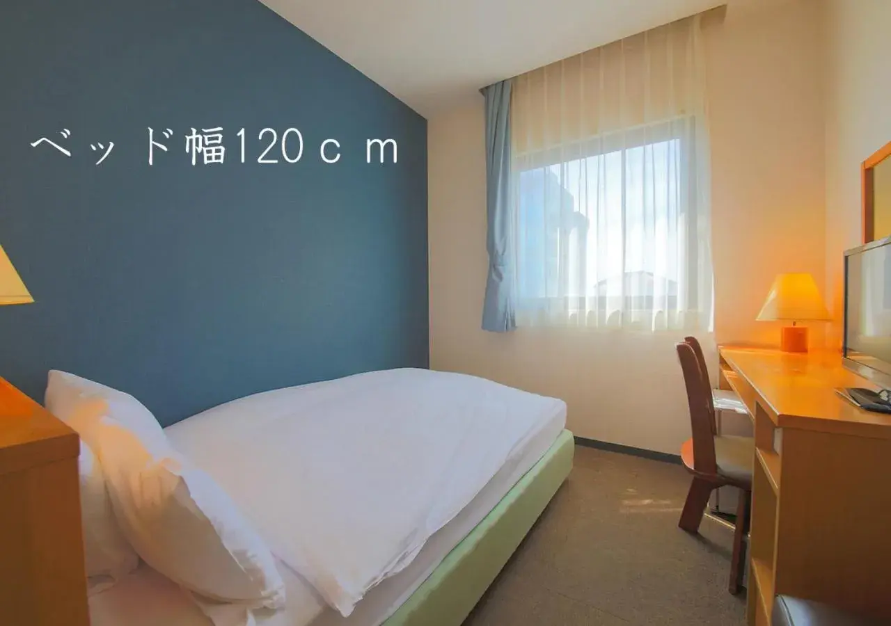 Bed in Heiwadai Hotel 5