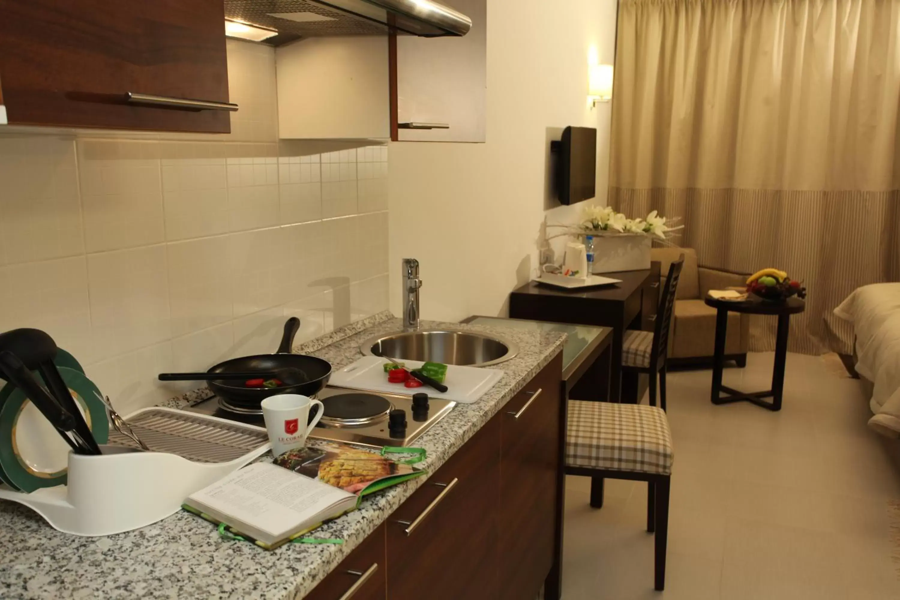 Photo of the whole room, Kitchen/Kitchenette in Le Corail Suites Hotel