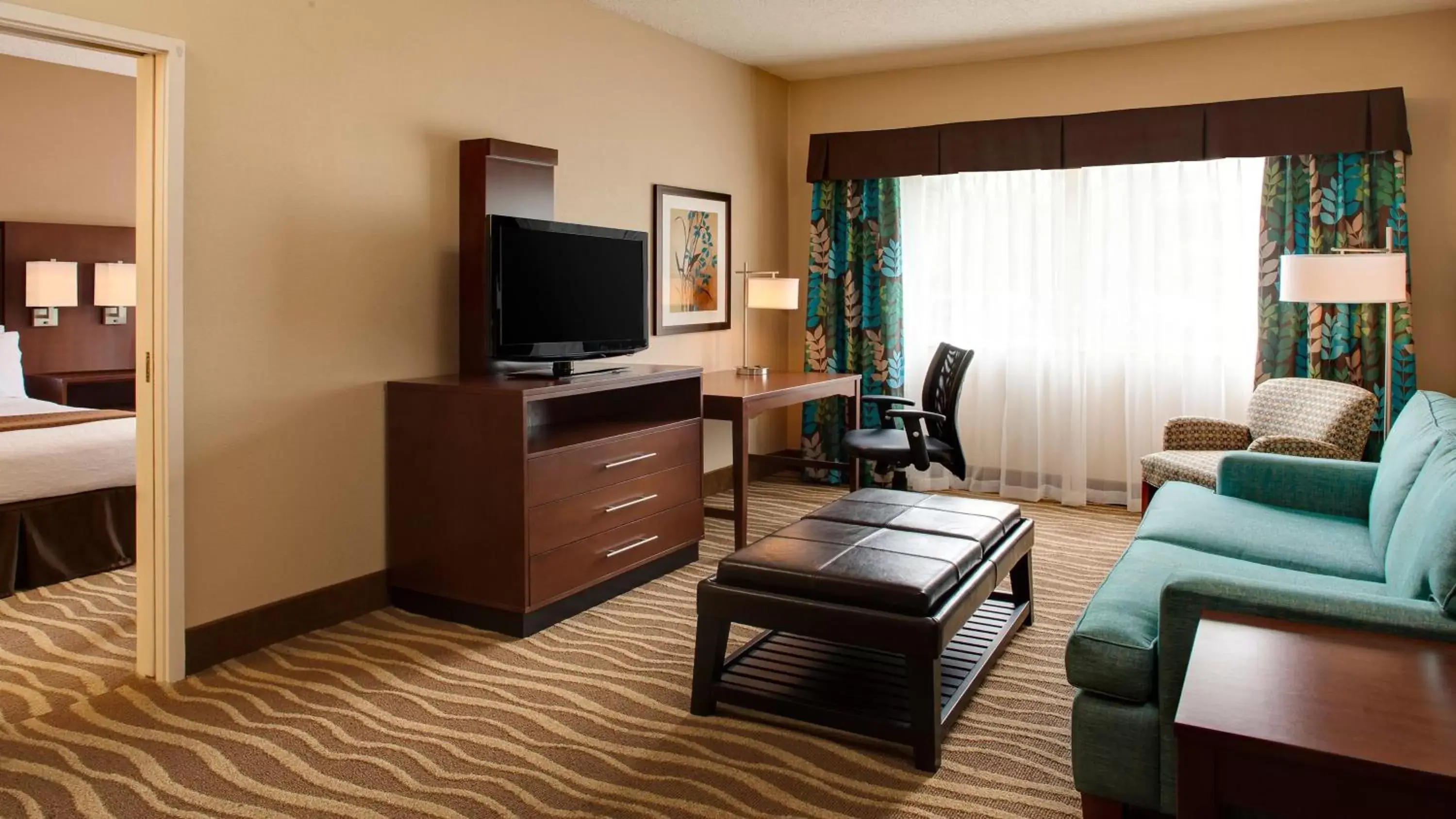 Photo of the whole room, TV/Entertainment Center in Holiday Inn Hotel & Suites Overland Park-West, an IHG Hotel