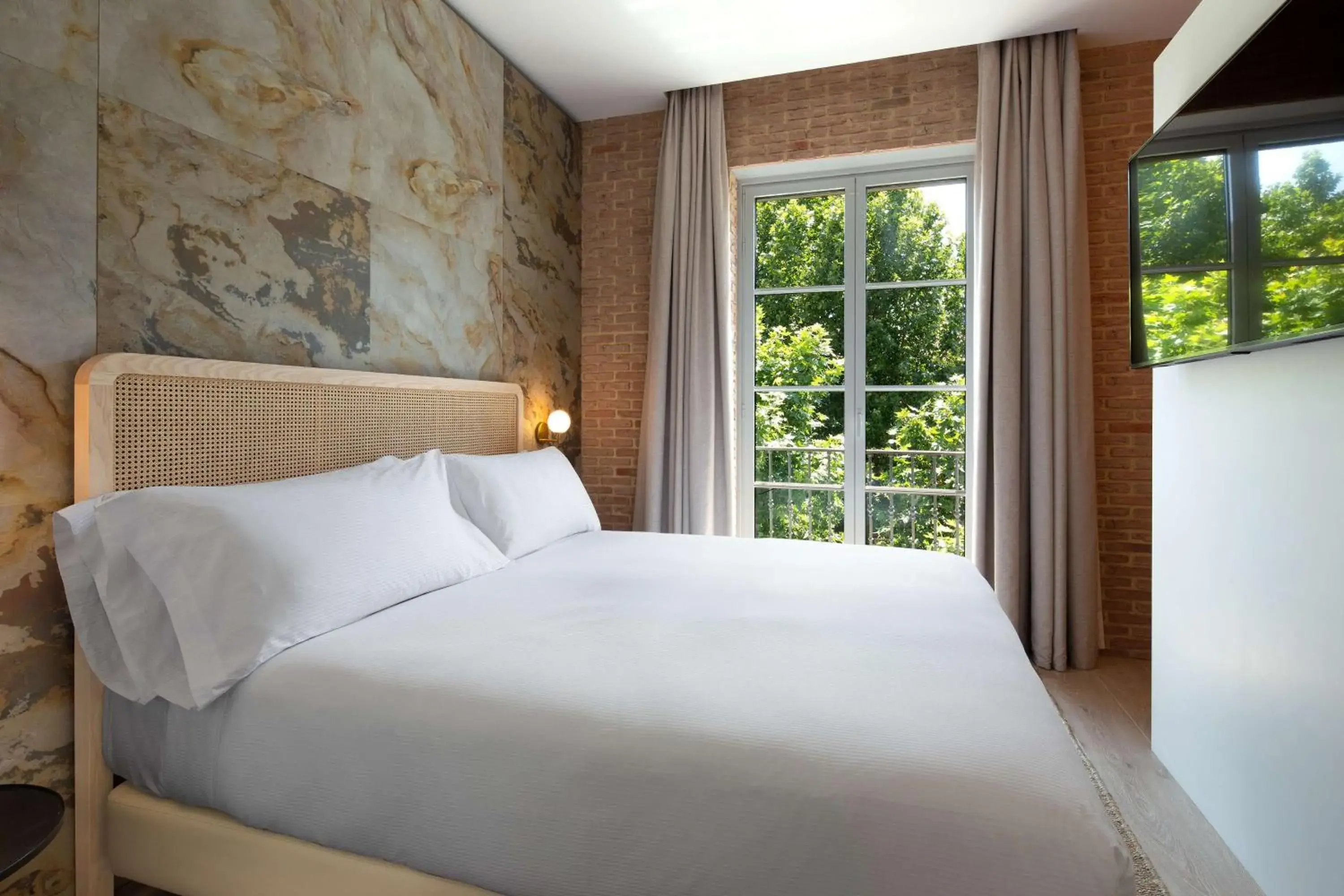 Bed in Atocha Hotel Madrid, Tapestry Collection by Hilton