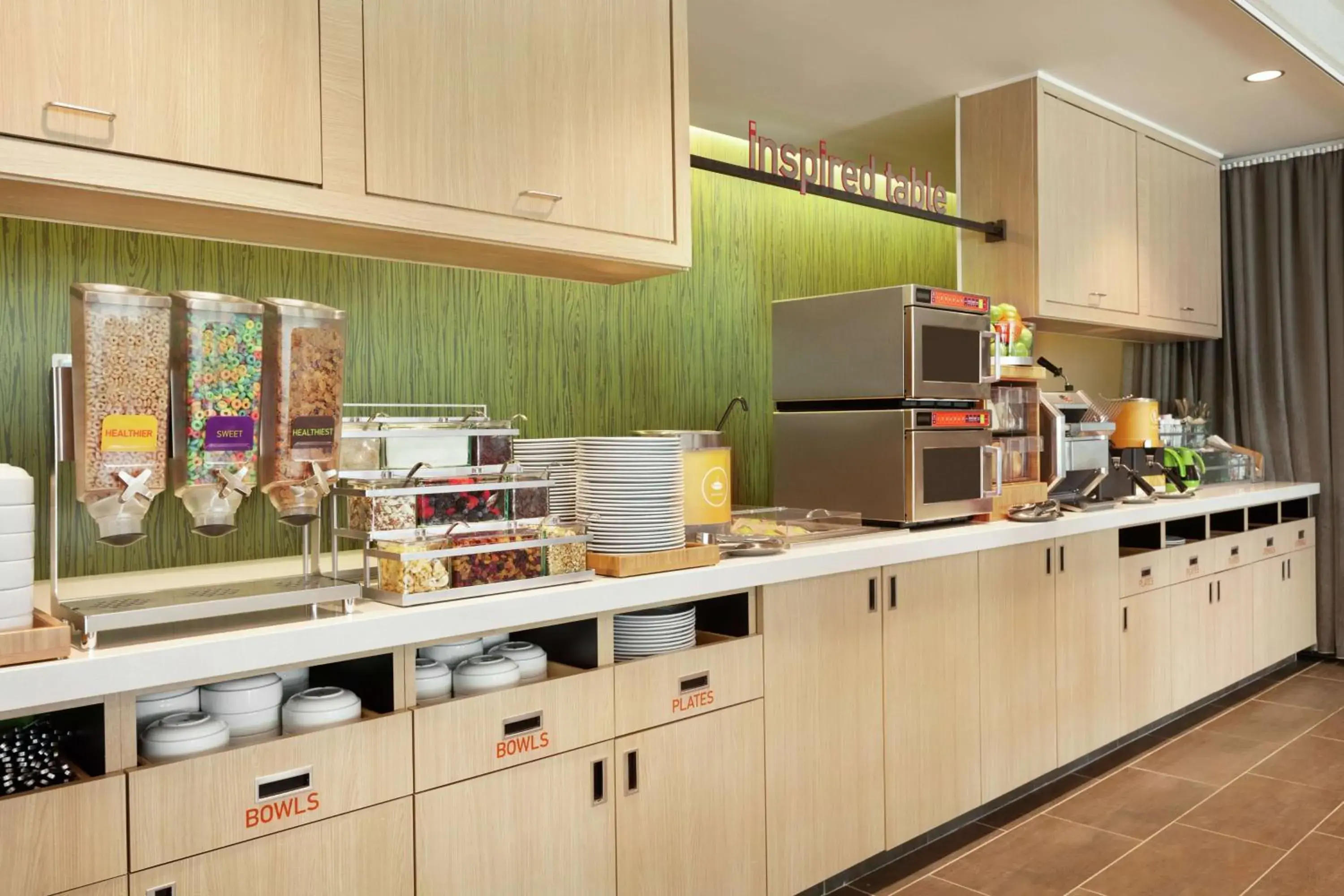 Breakfast, Kitchen/Kitchenette in Home2 Suites by Hilton Sarasota - Bradenton Airport, FL
