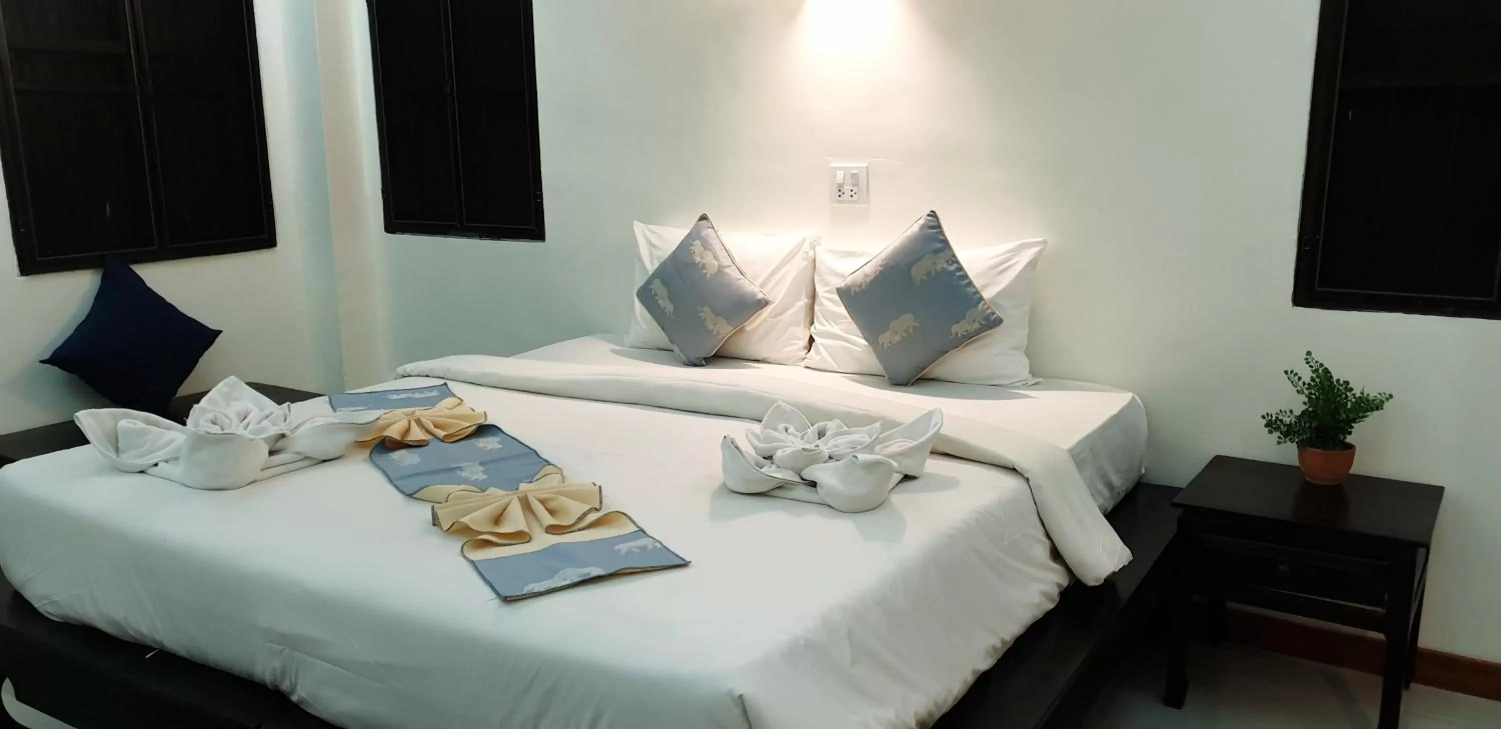 Bed in Rainforest Huahin Village Hotel