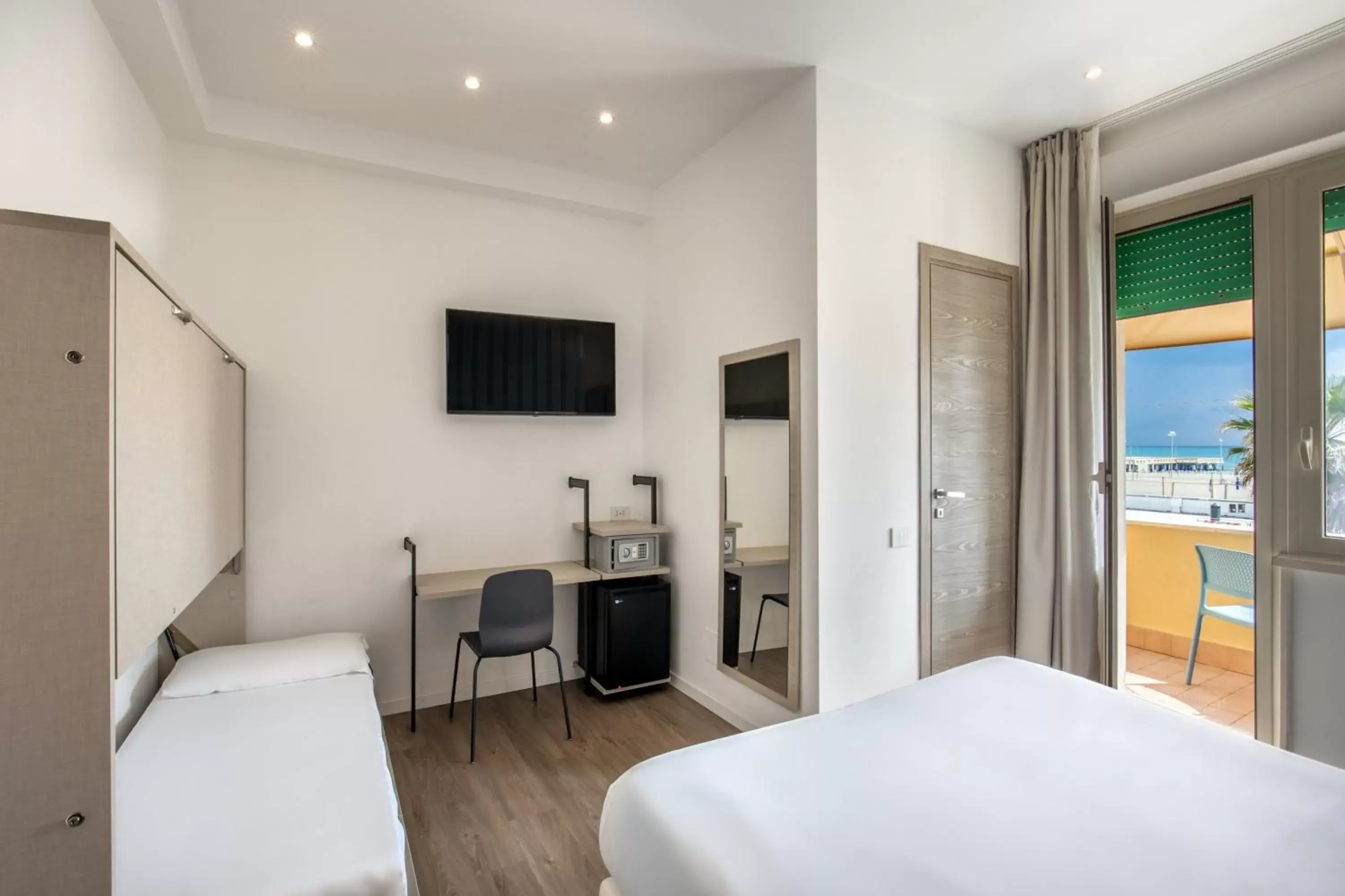 Bed, TV/Entertainment Center in Hotel La Scaletta