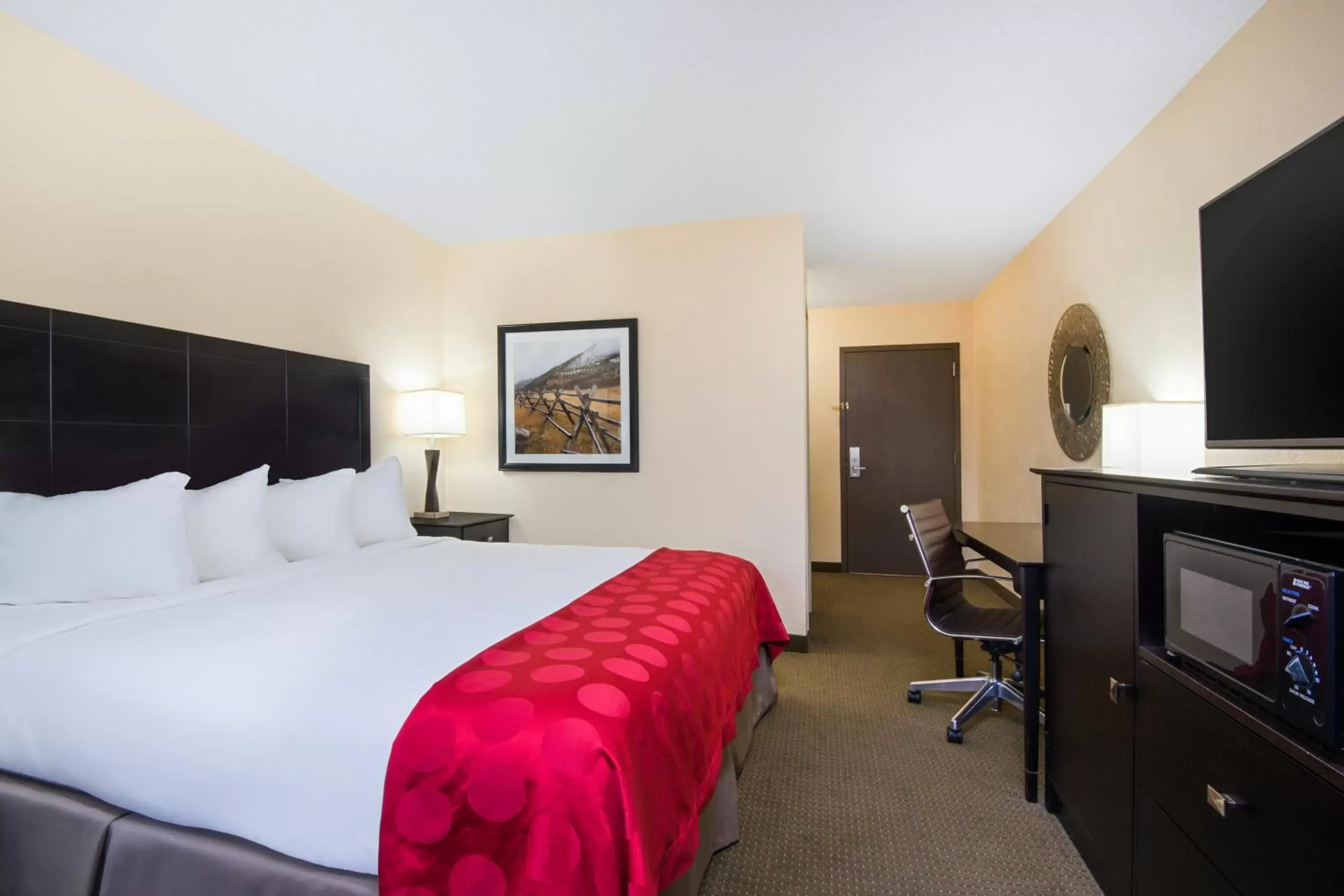 Bed in Ramada Plaza by Wyndham Gillette Conference Center