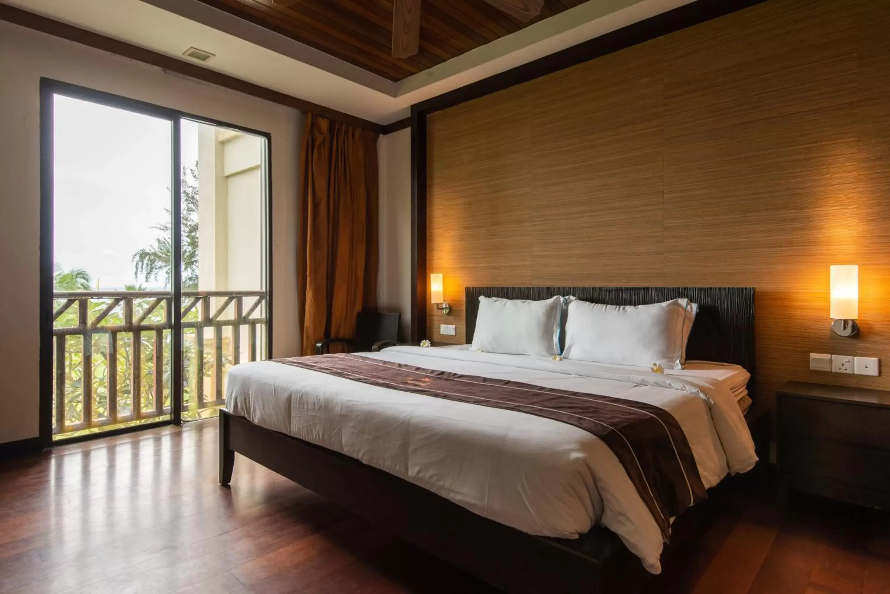 Bed in Sabah Beach Villas & Suites