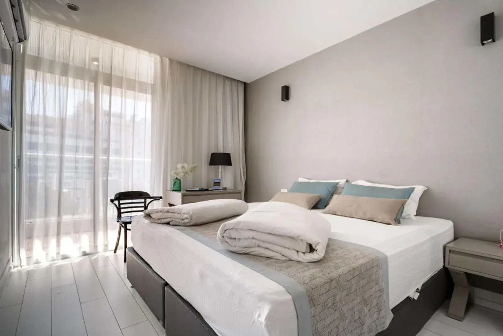 Bed in Kikar Boutique Hotel