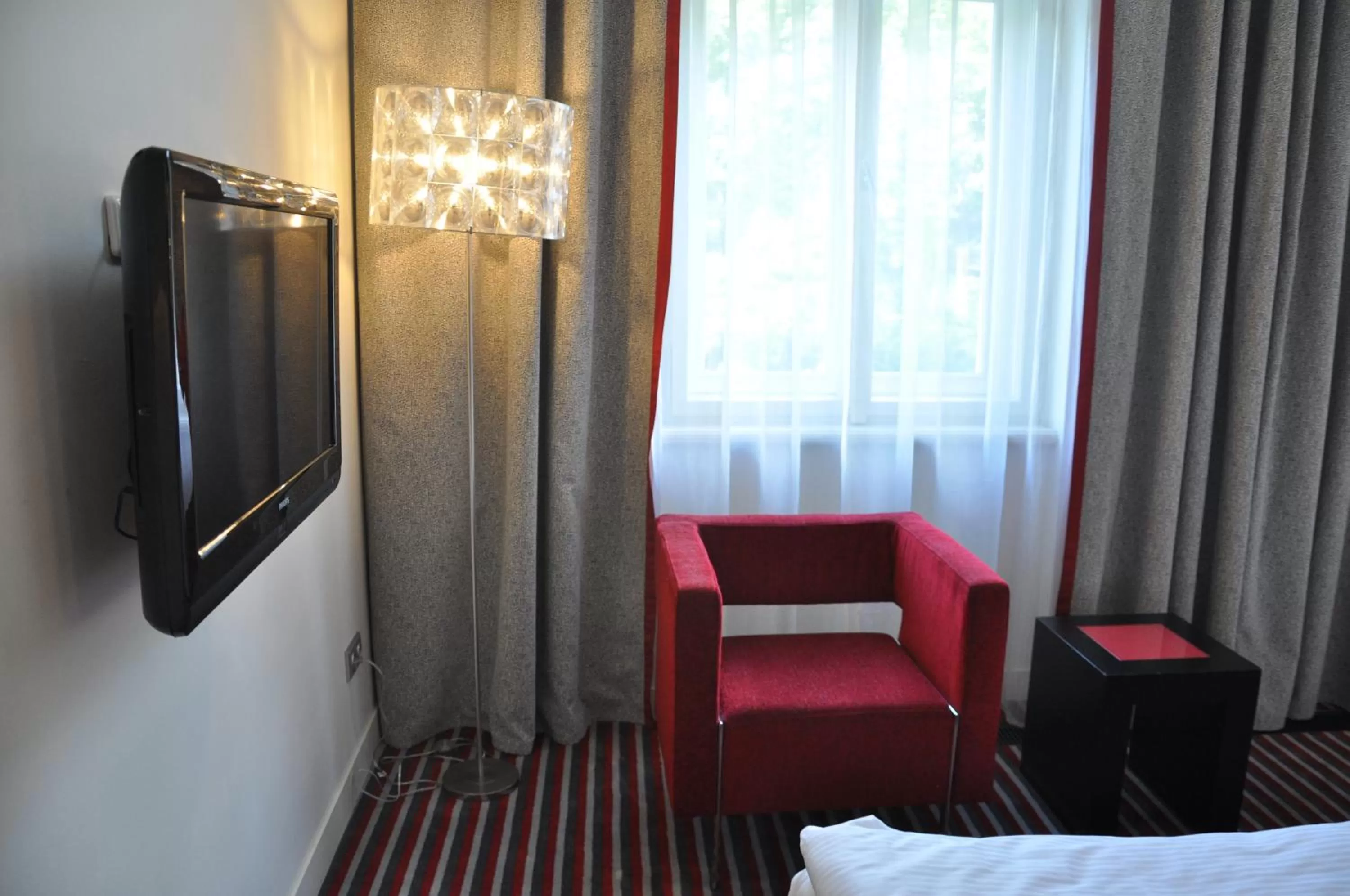 Seating area, Bed in Red & Blue Design Hotel Prague