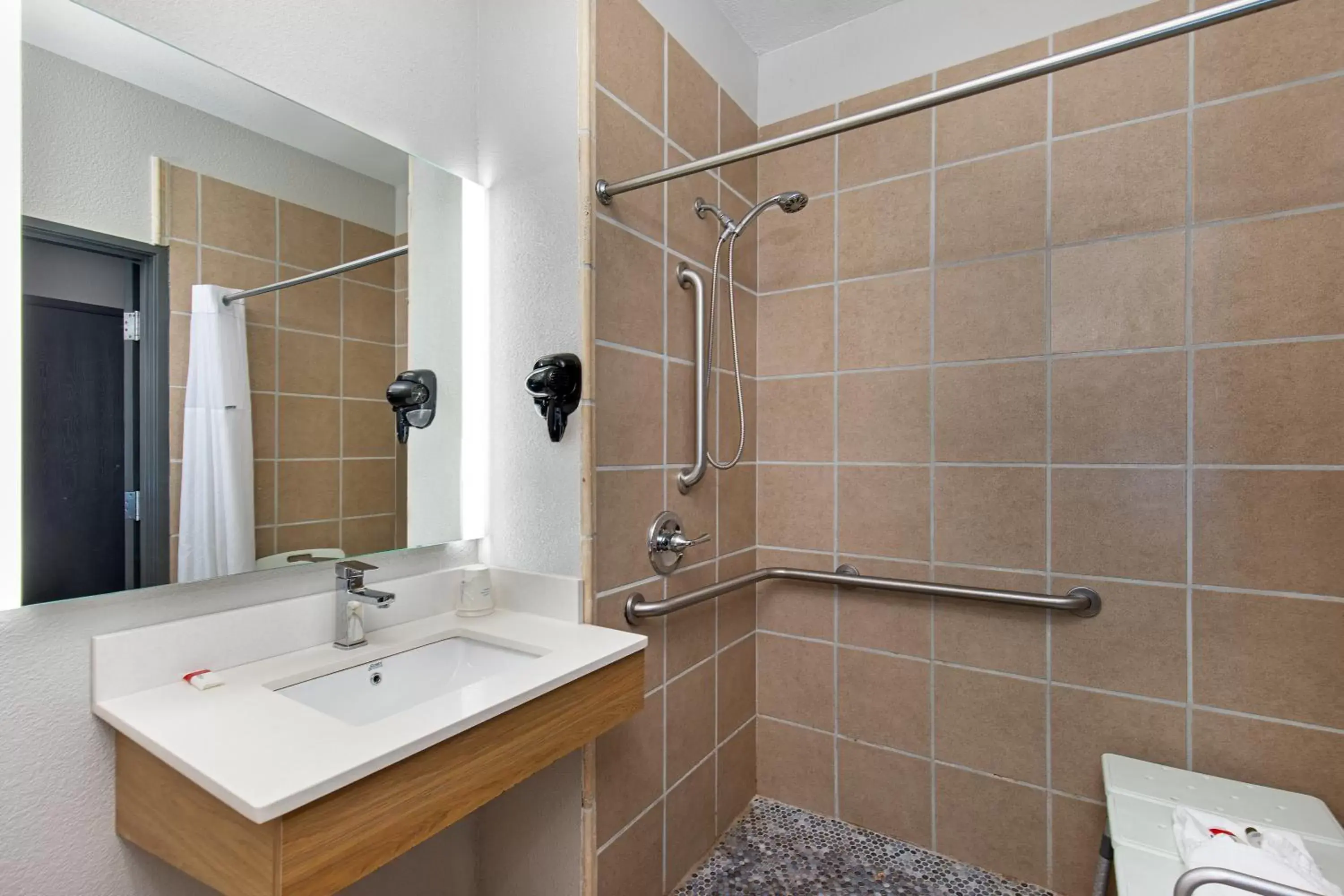 Bathroom in Microtel Inn & Suites by Wyndham Manchester - Newly Renovated
