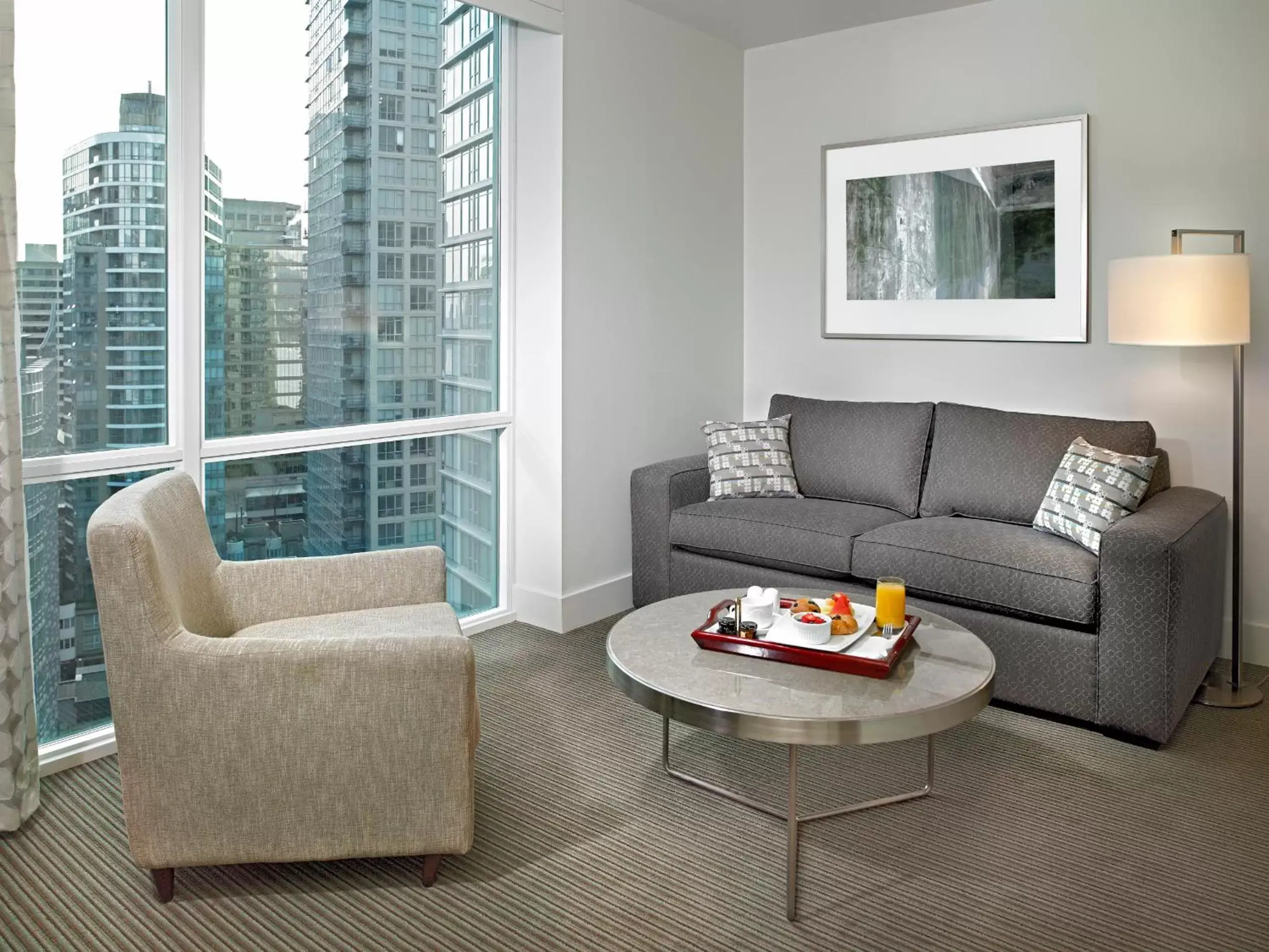 Seating Area in Coast Coal Harbour Vancouver Hotel by APA