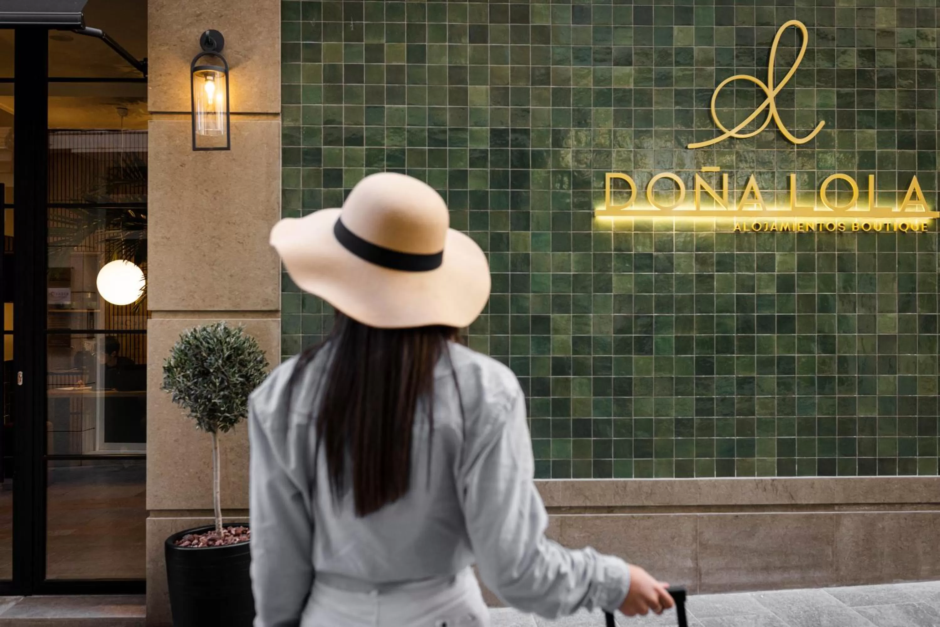 Property logo or sign in Doña Lola Alojamientos Boutique