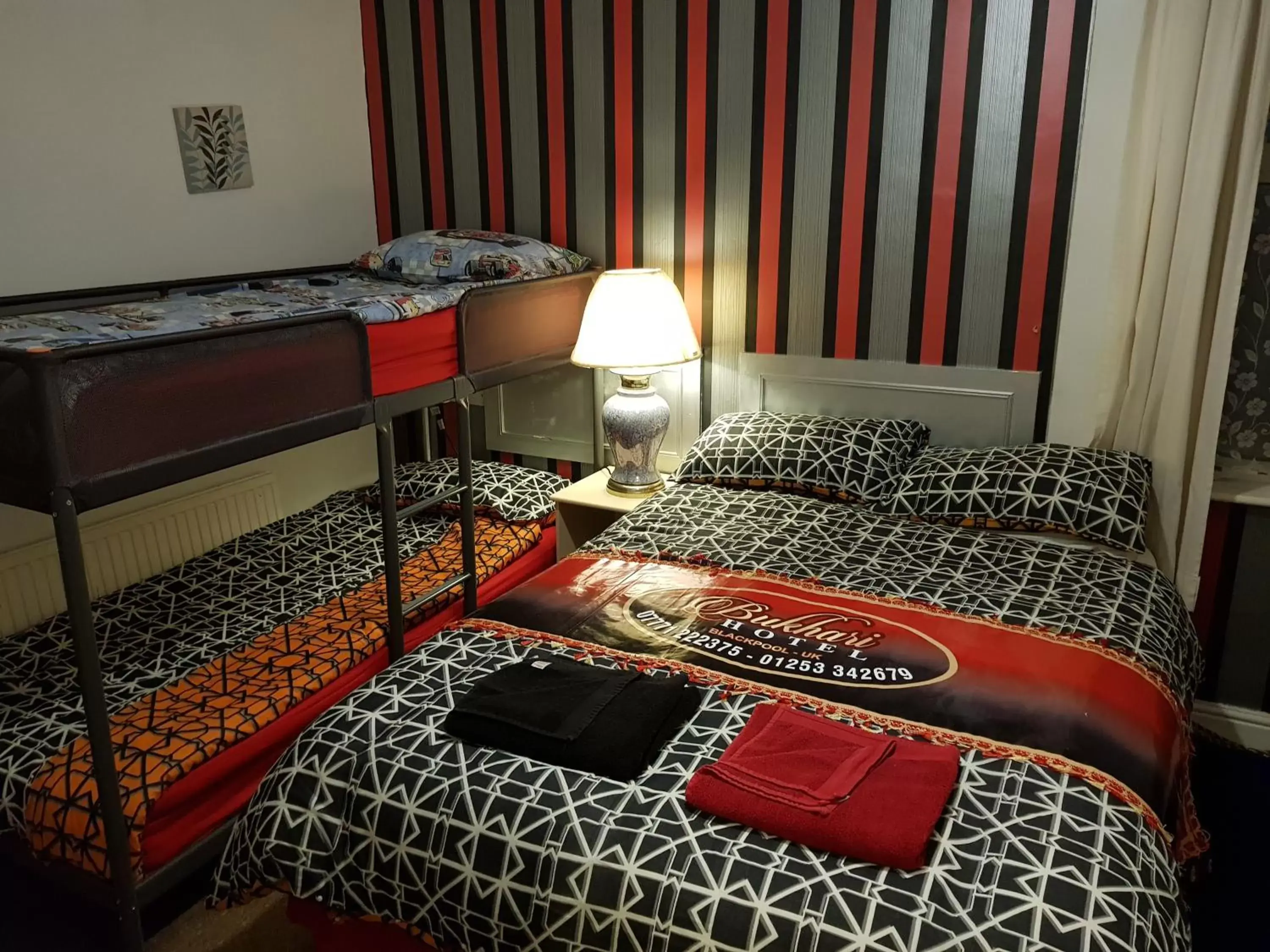 Bed in BUKHARI Hotel