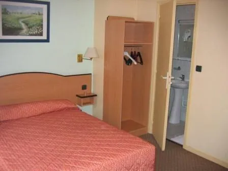 Bed in Hotel Ferney République