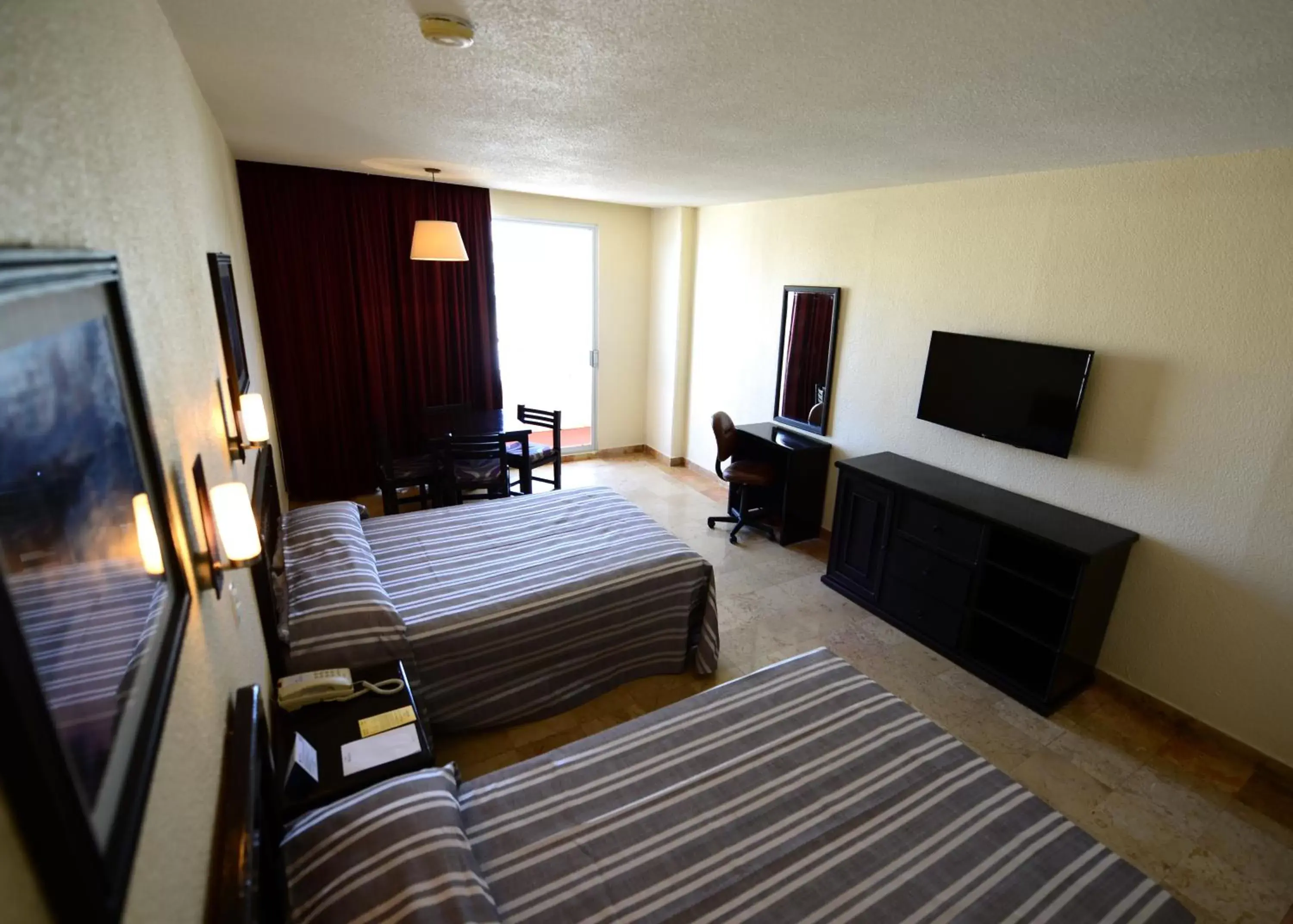 Photo of the whole room, TV/Entertainment Center in Amarea Hotel Acapulco