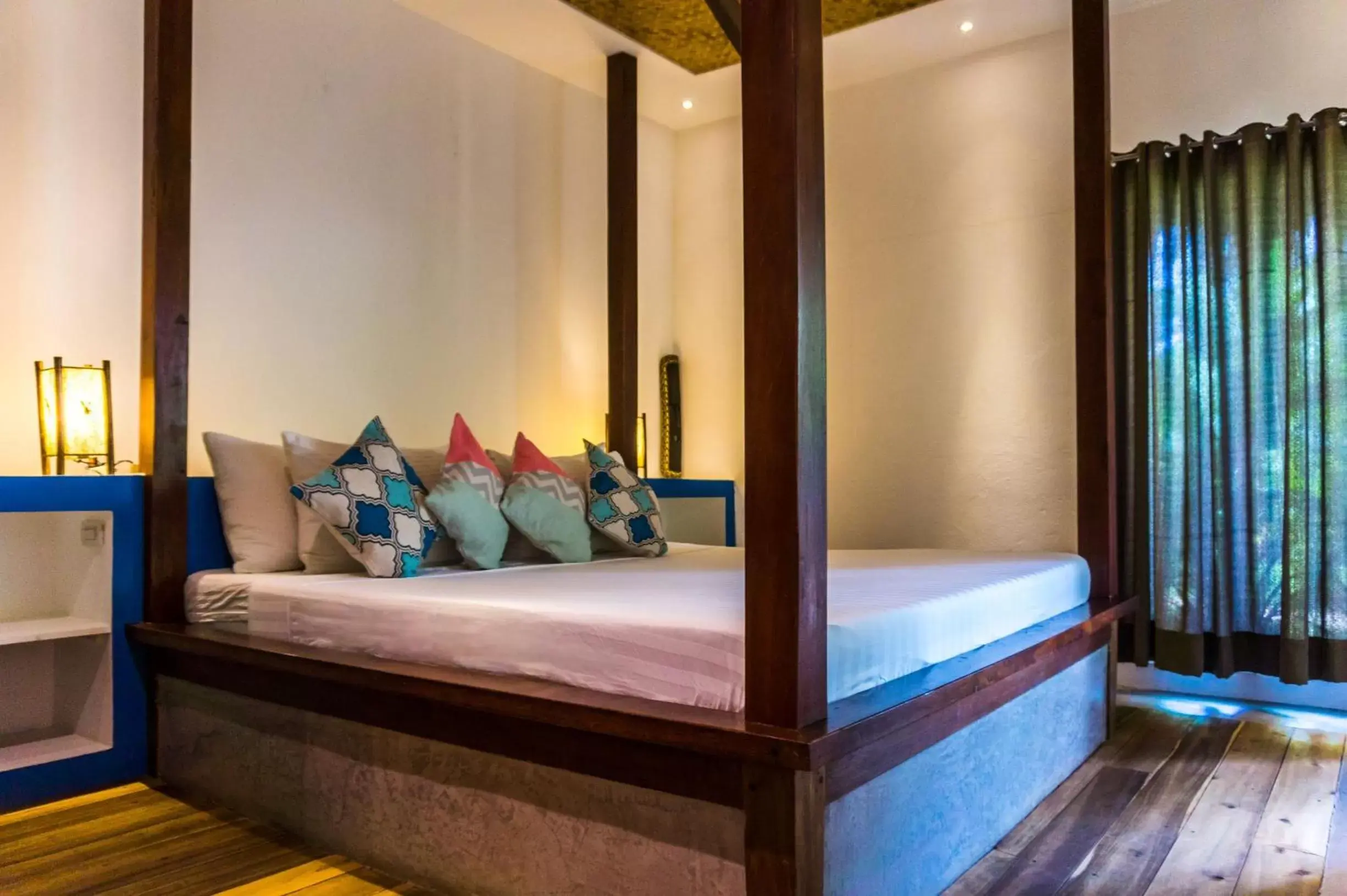 Bed in Mahogany Resort & Spa Bed in Mahogany Resort & Spa