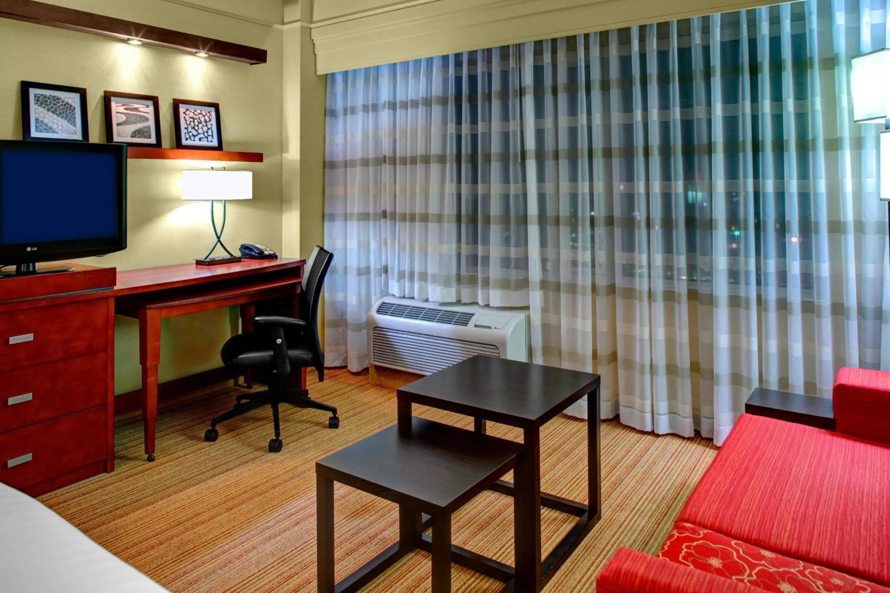 Photo of the whole room, TV/Entertainment Center in Courtyard by Marriott Greenville Downtown