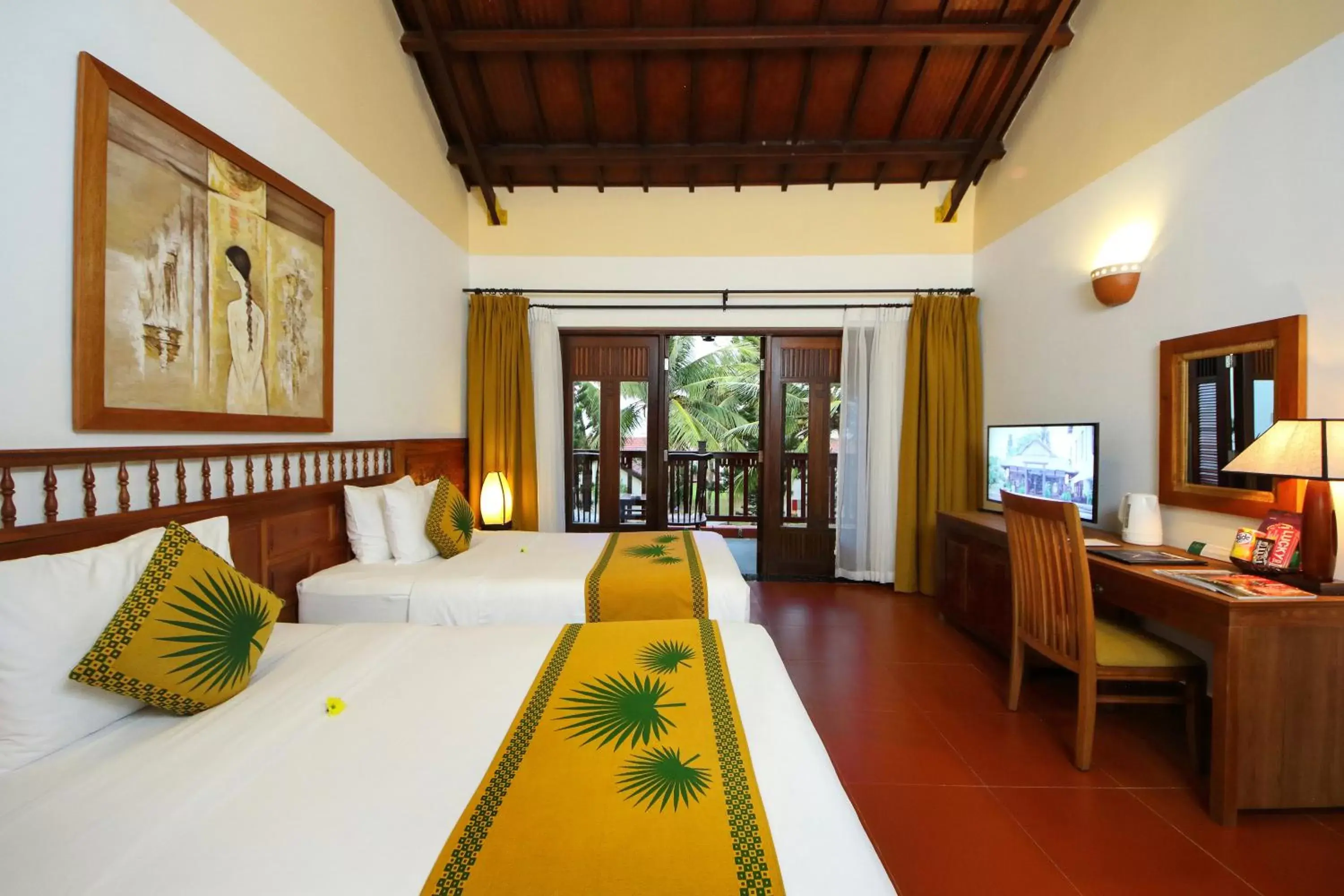 Bed in Palm Garden Beach Resort & Spa