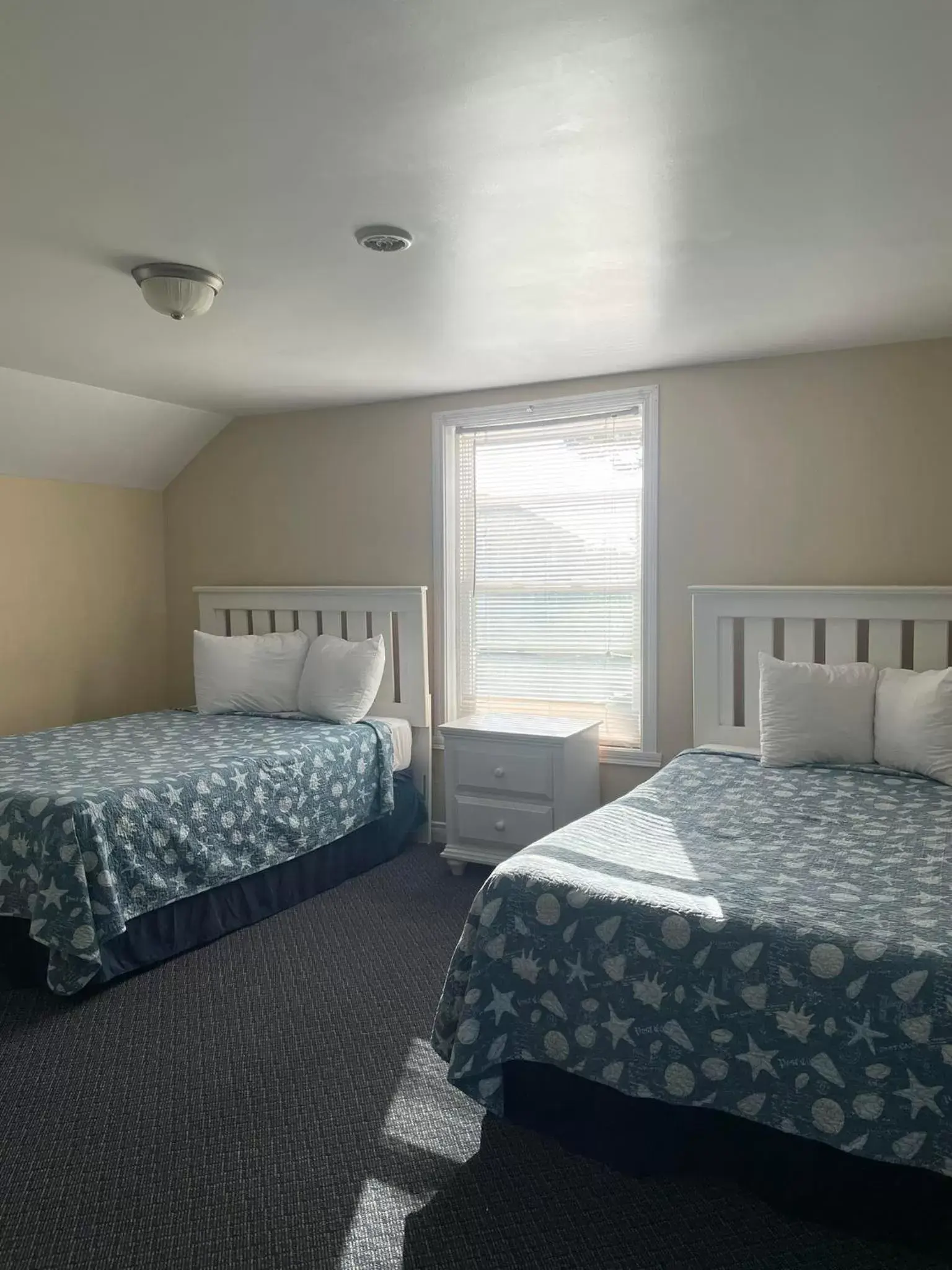 Bed in Grand Beach Inn