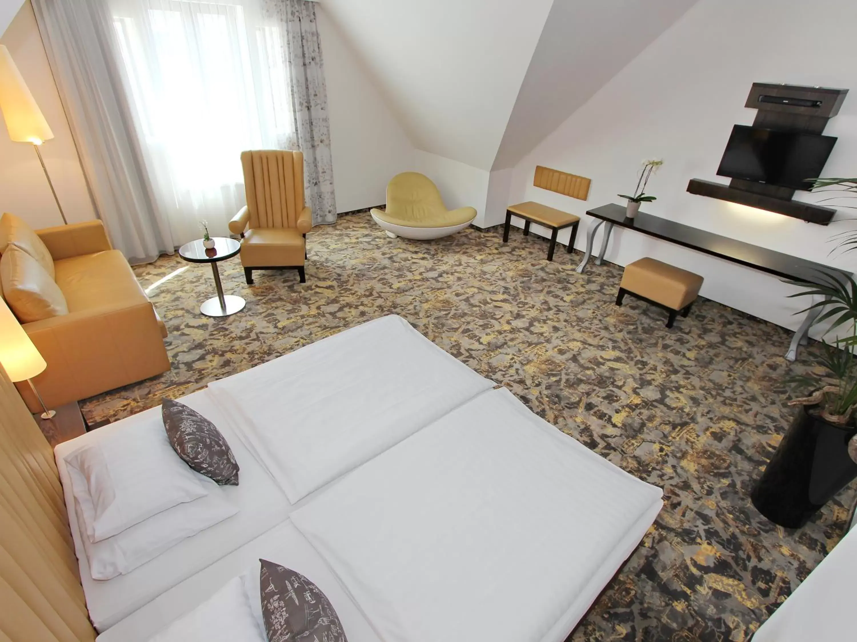 Bedroom, Seating Area in ARCOTEL Camino Stuttgart