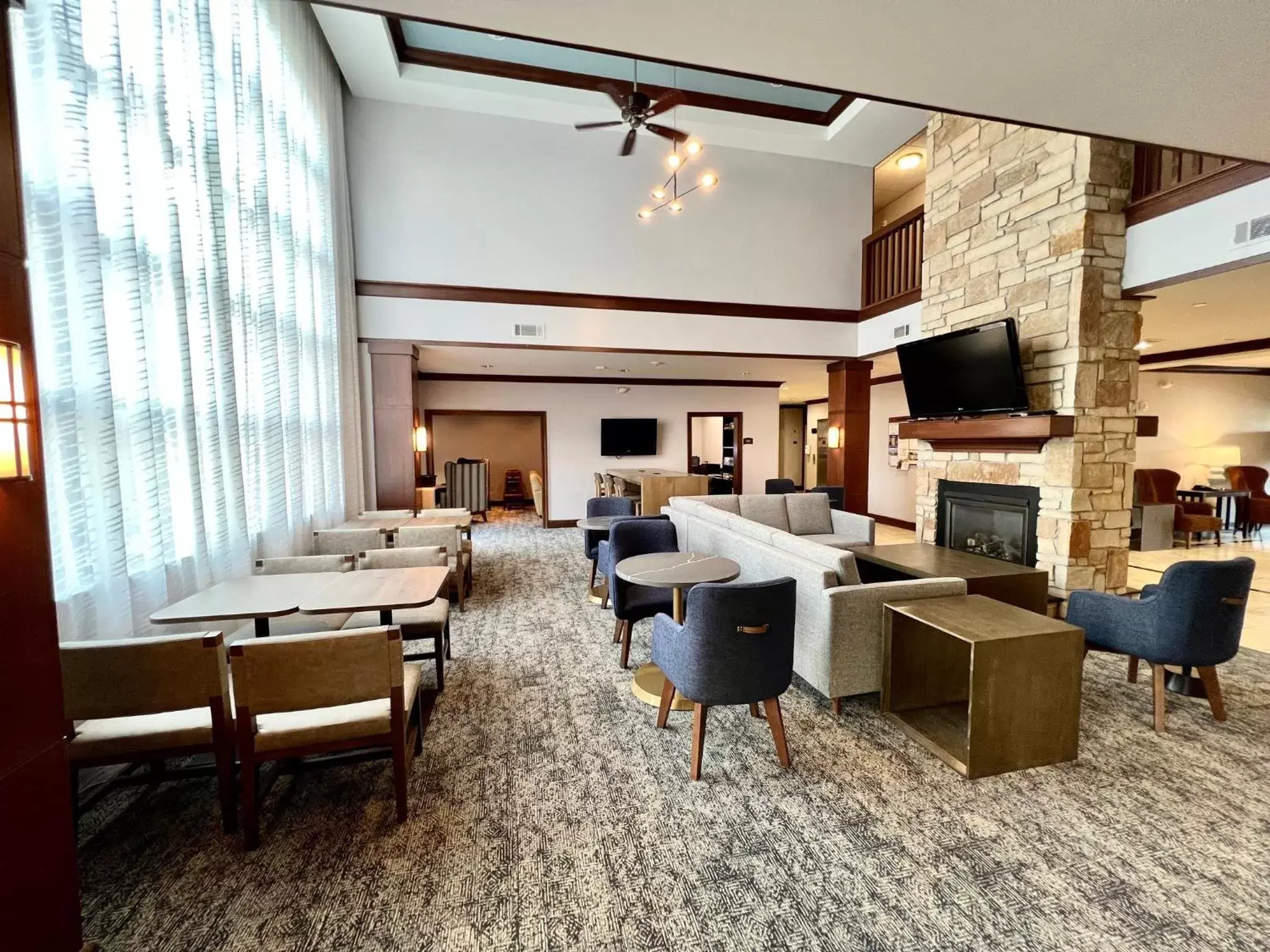 Property building, Seating Area in Staybridge Suites Milwaukee West-Oconomowoc, an IHG Hotel