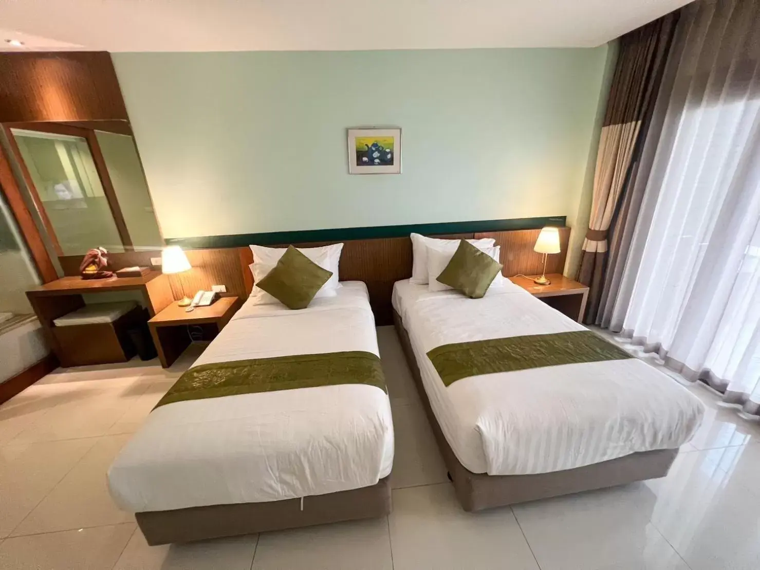 Bed in Siam Triangle Hotel