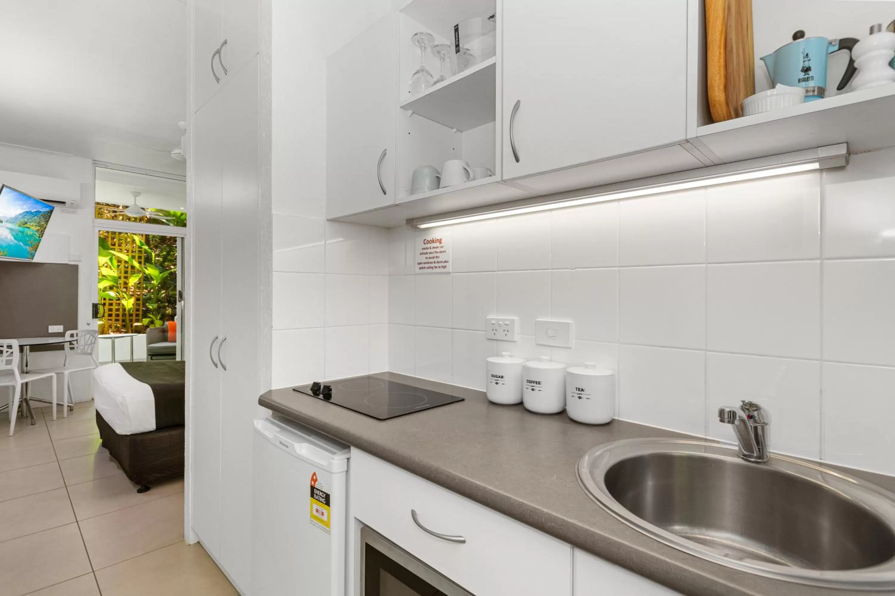 Kitchen or kitchenette in By The Sea Port Douglas