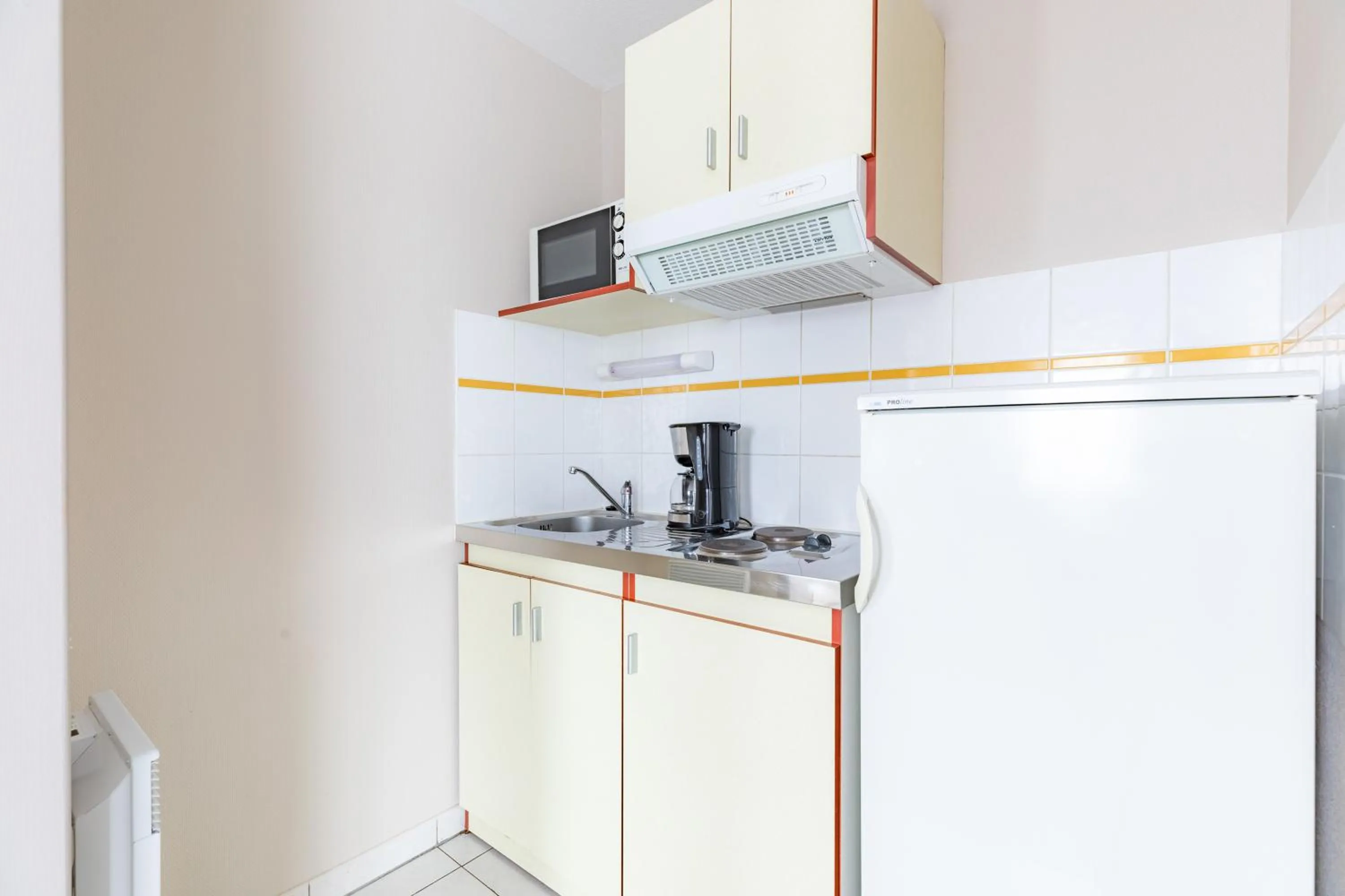 Kitchen or kitchenette in Appart'City Classic Limoges