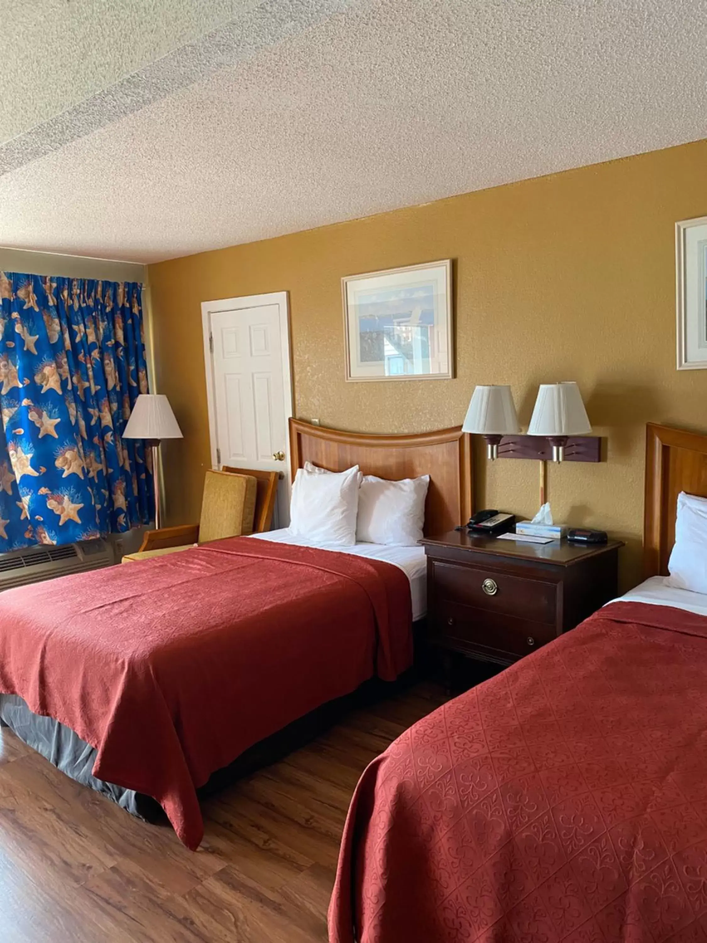 Bed in Atlantic Shores Inn and Suites