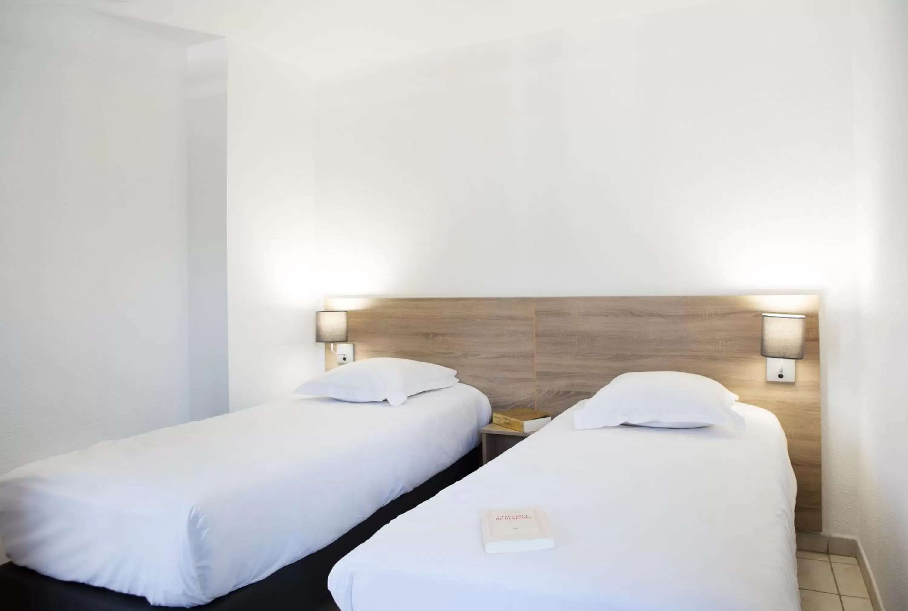 Bed in Zenitude Hôtel-Résidences La Versoix