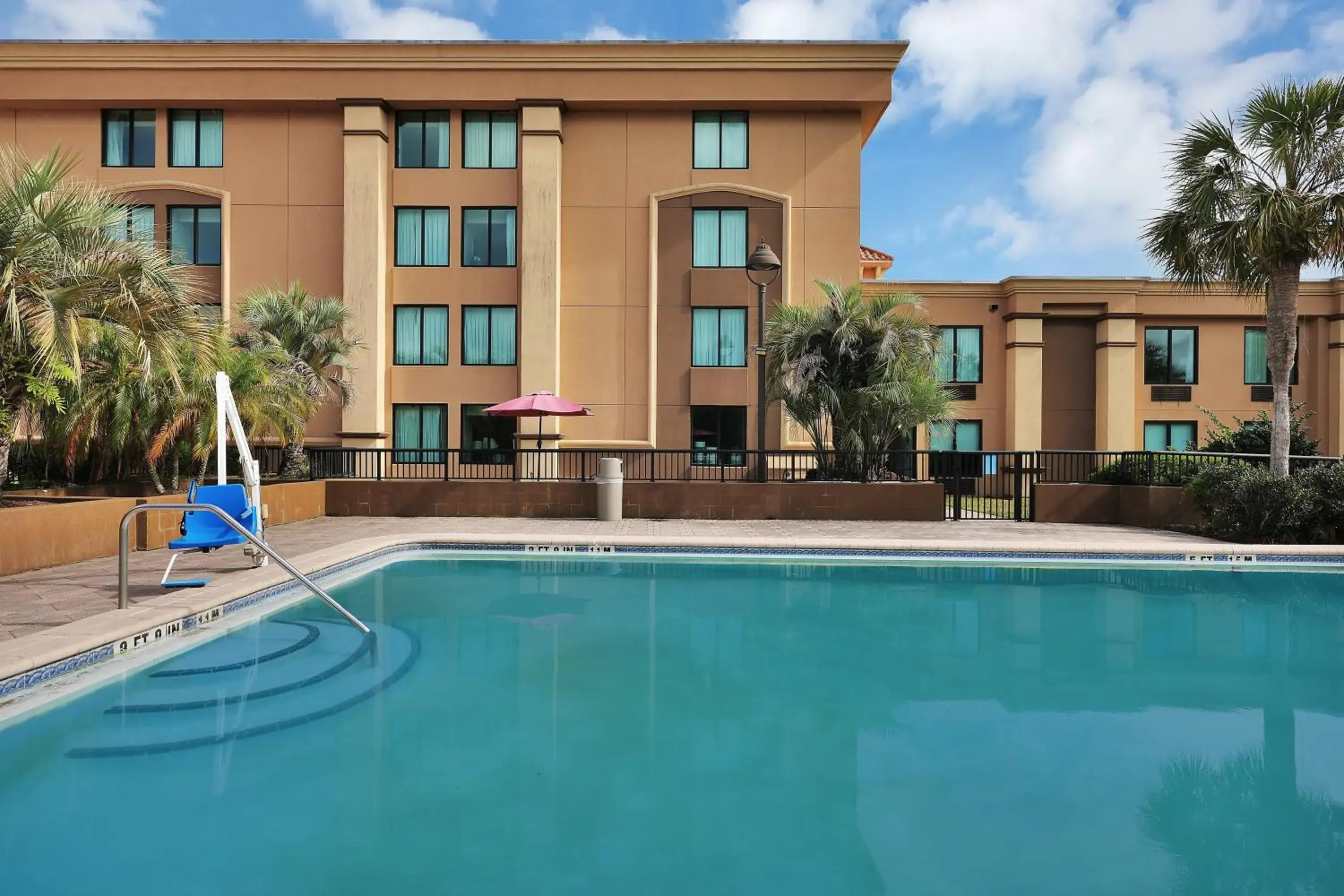 Swimming Pool in Ramada by Wyndham Jacksonville I-95 by Butler Blvd
