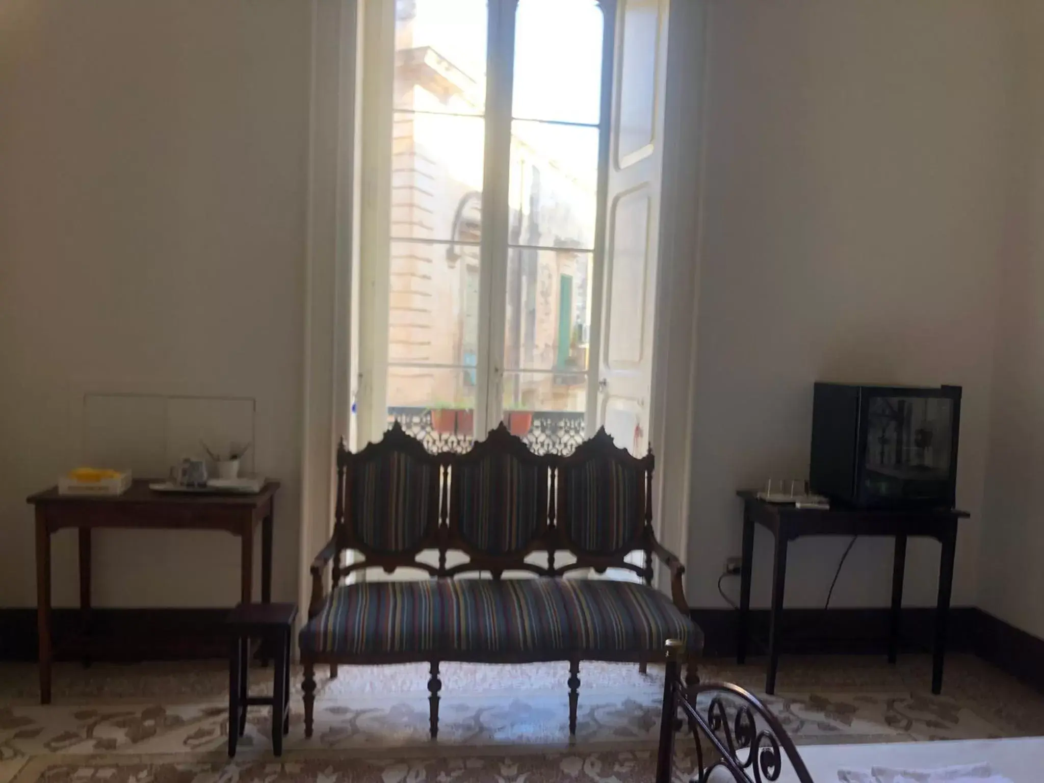 Seating area, Bed in Palazzo Bernardini Suites