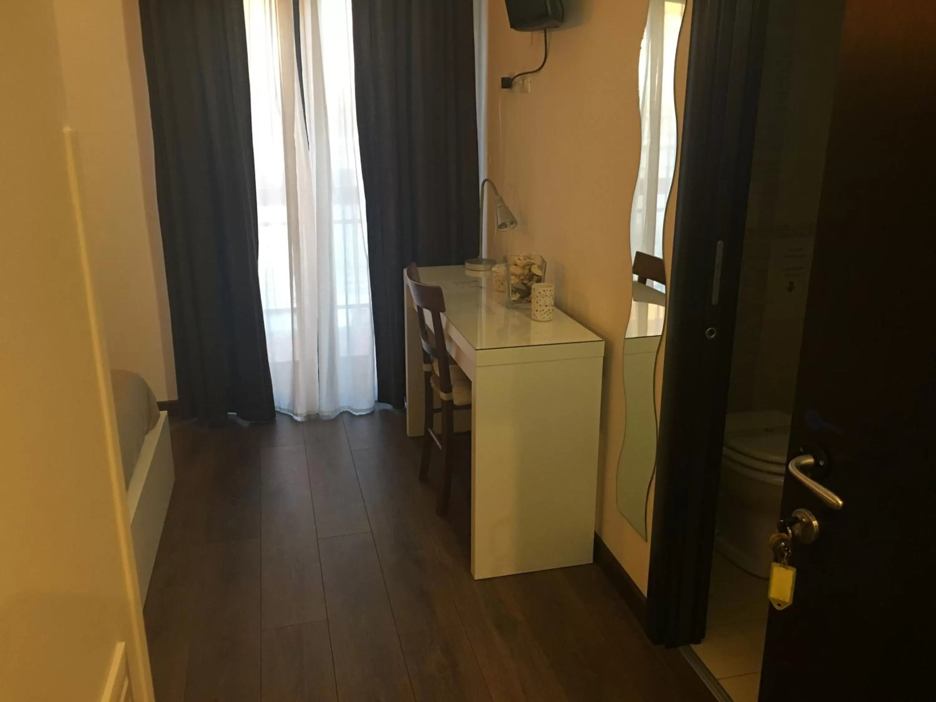 Bedroom, TV/Entertainment Center in Almi Rooms