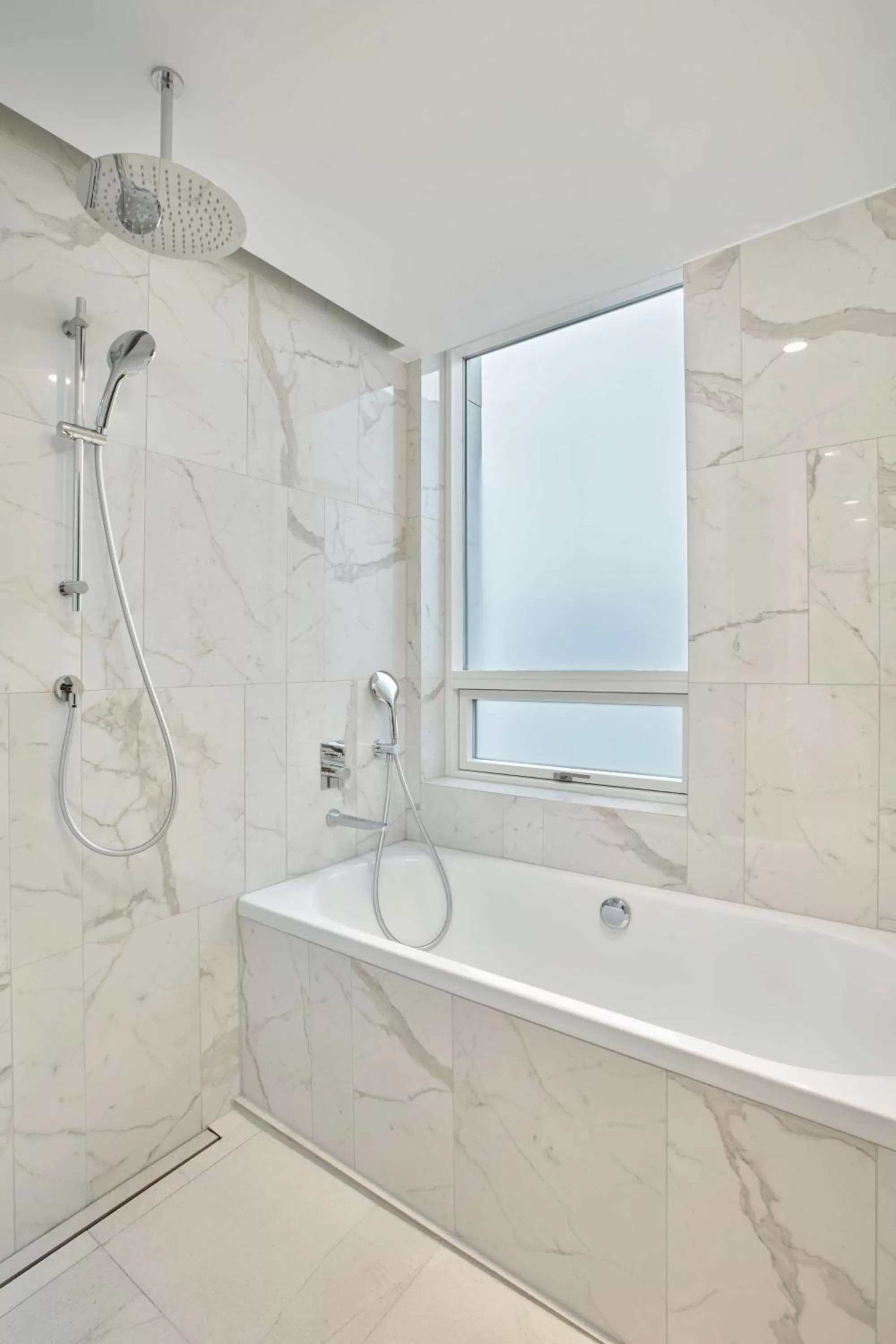 Bathroom in Iceland Parliament Hotel, Curio Collection By Hilton