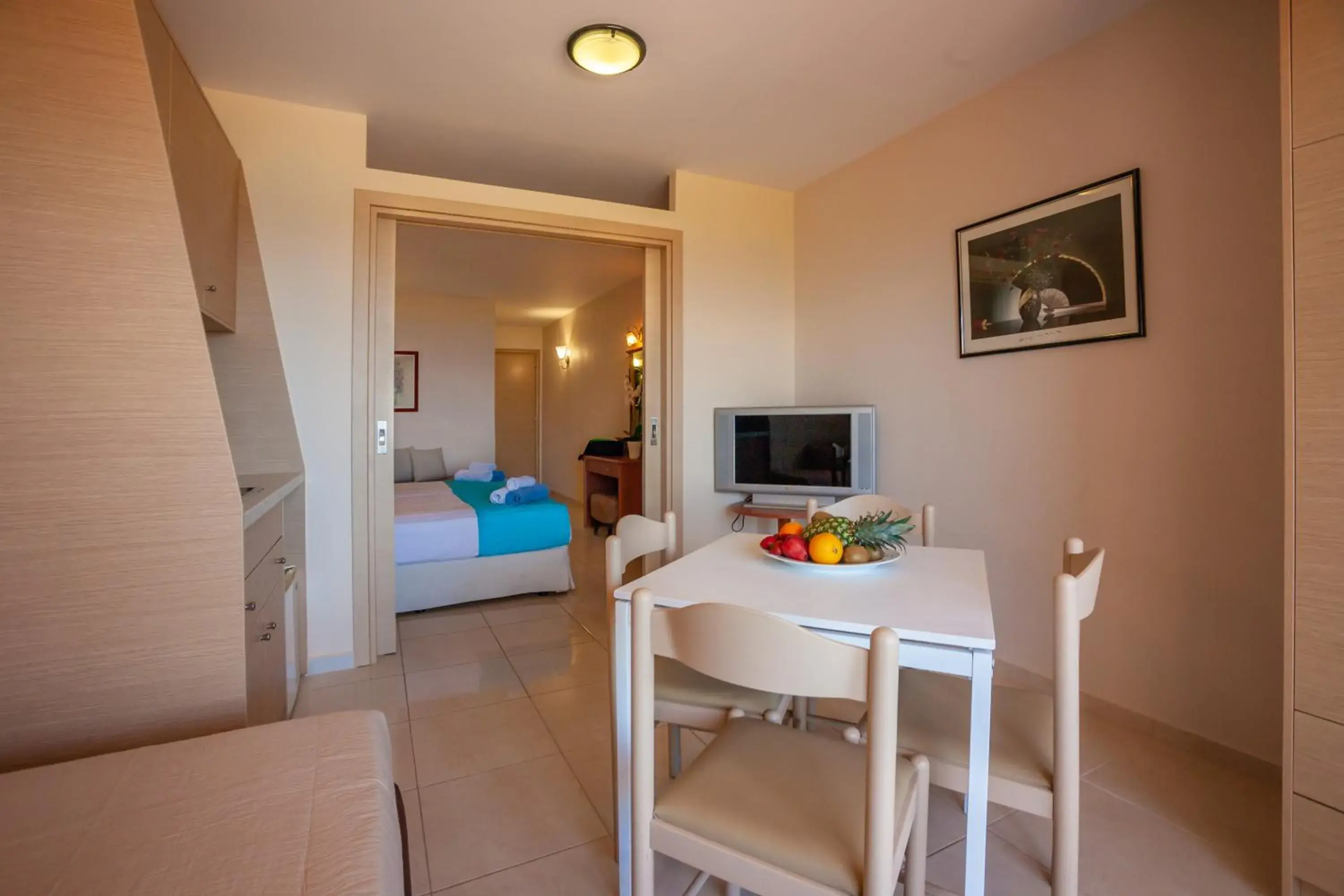 Bed, Dining Area in Elounda Water Park Residence Hotel