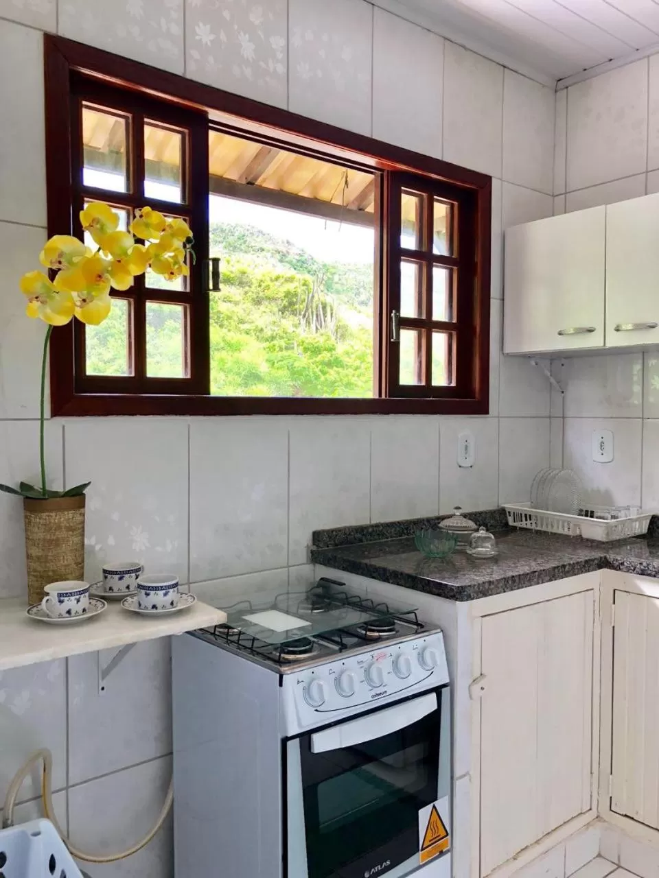 Kitchen/Kitchenette in Pousada Recanto Das Emerências