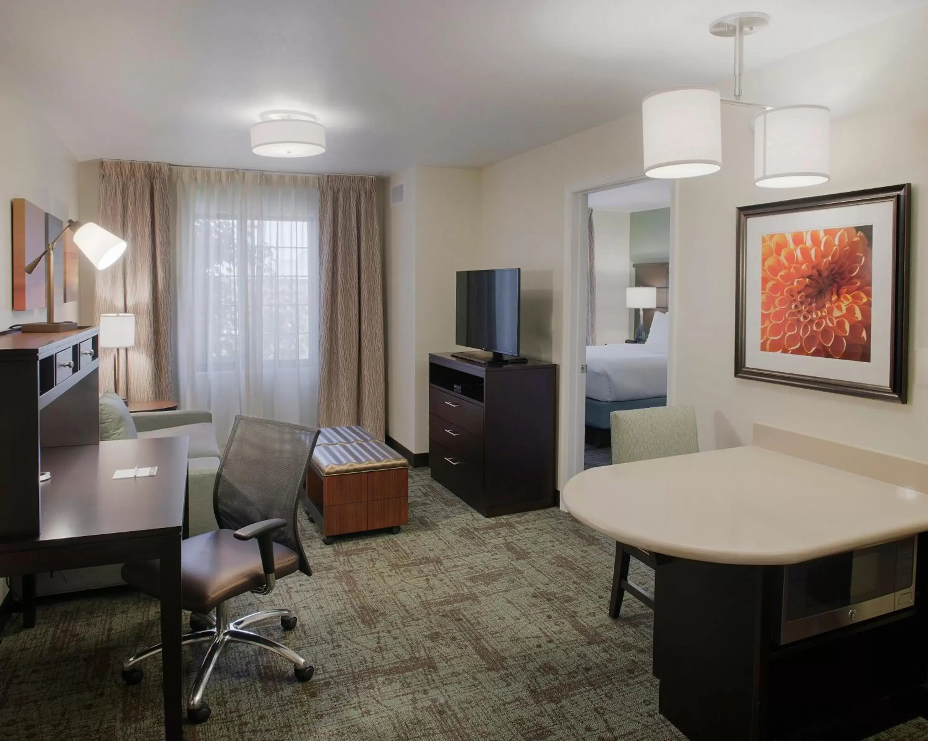 Photo of the whole room, TV/Entertainment Center in Staybridge Suites Fayetteville, an IHG Hotel