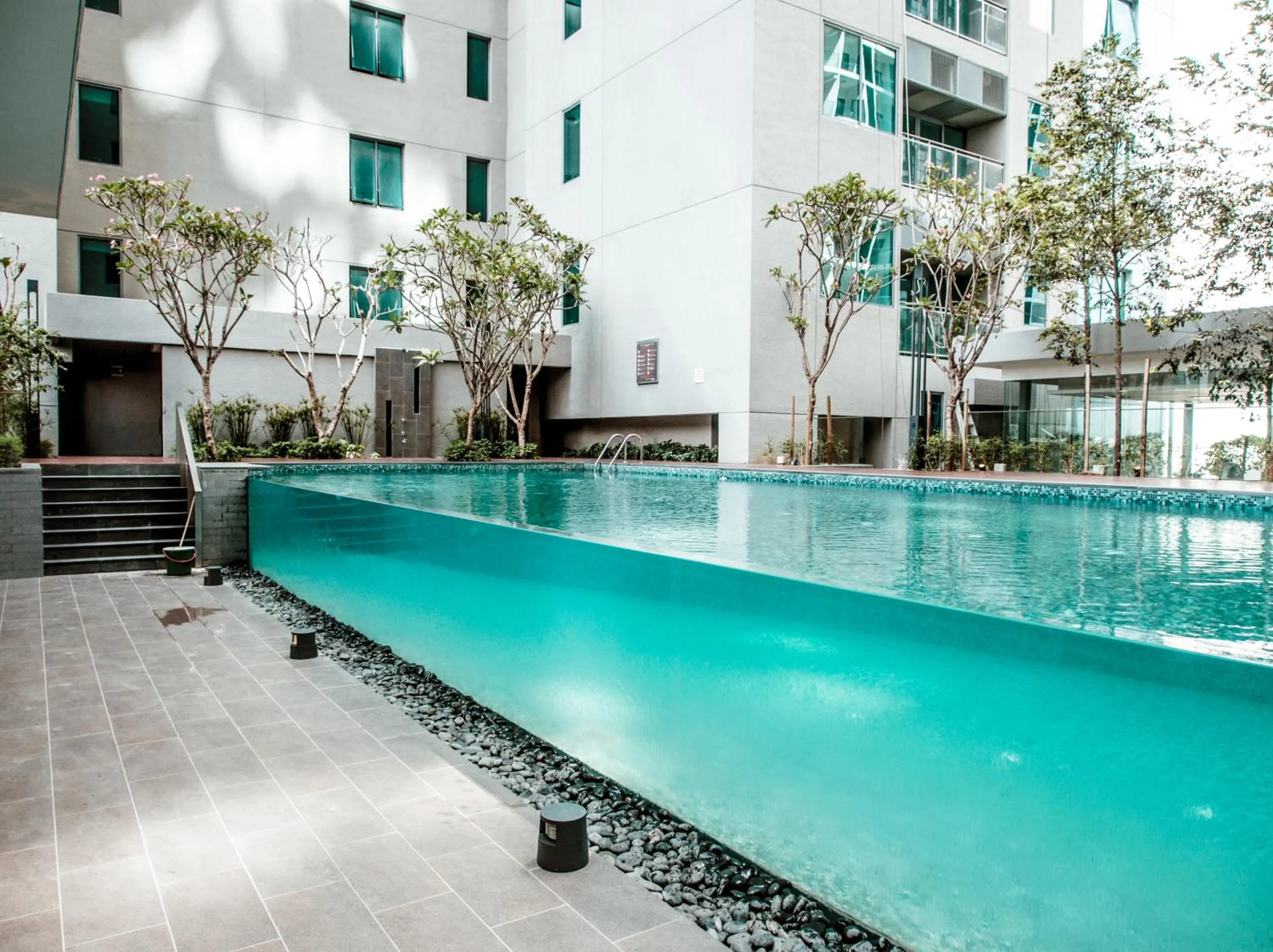 Swimming pool in Summer Suites Residences by Subhome