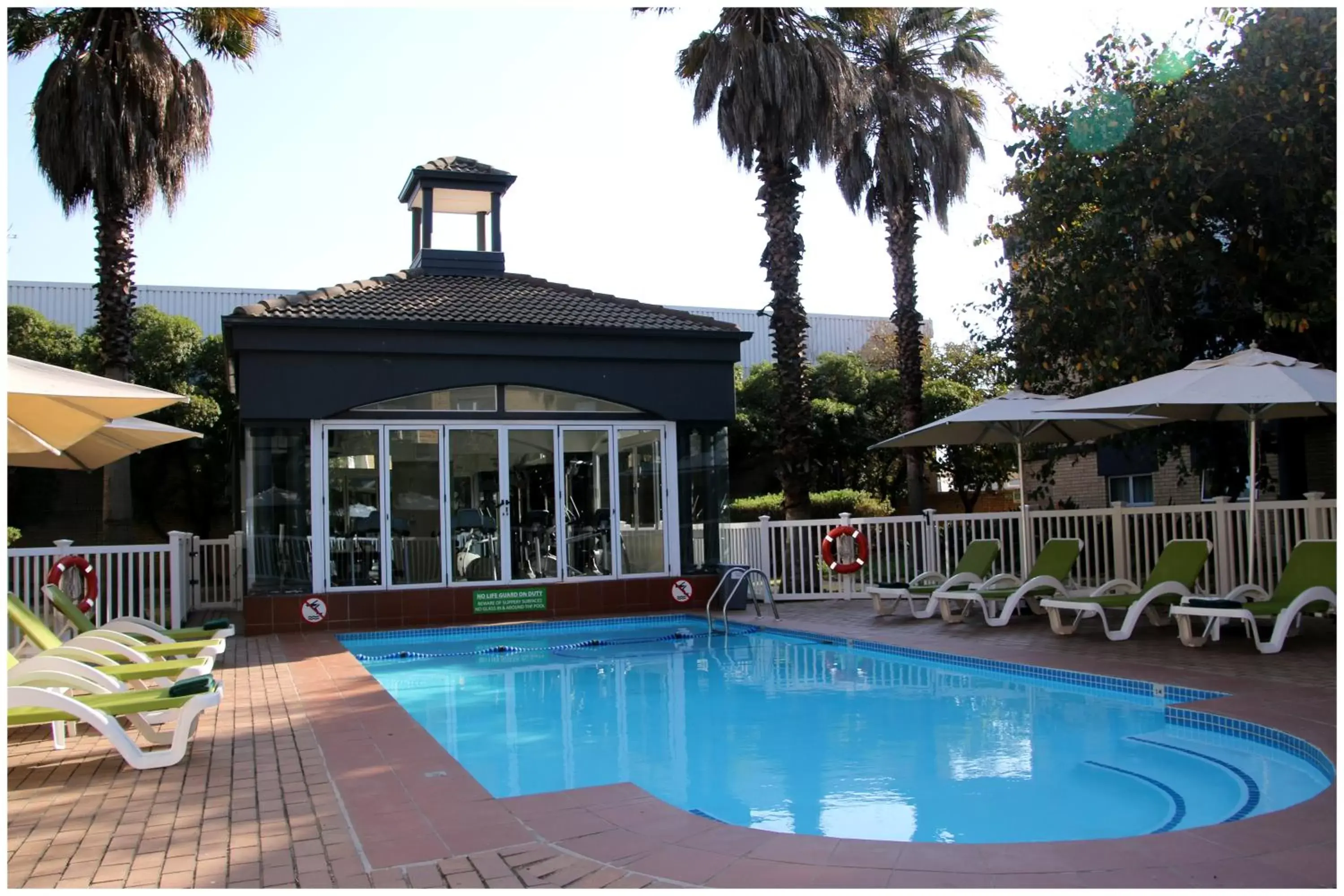 Pool view in Holiday Inn Johannesburg OR Tambo Airport Hotel by IHG Pool view in Holiday Inn Johannesburg OR Tambo Airport Hotel by IHG