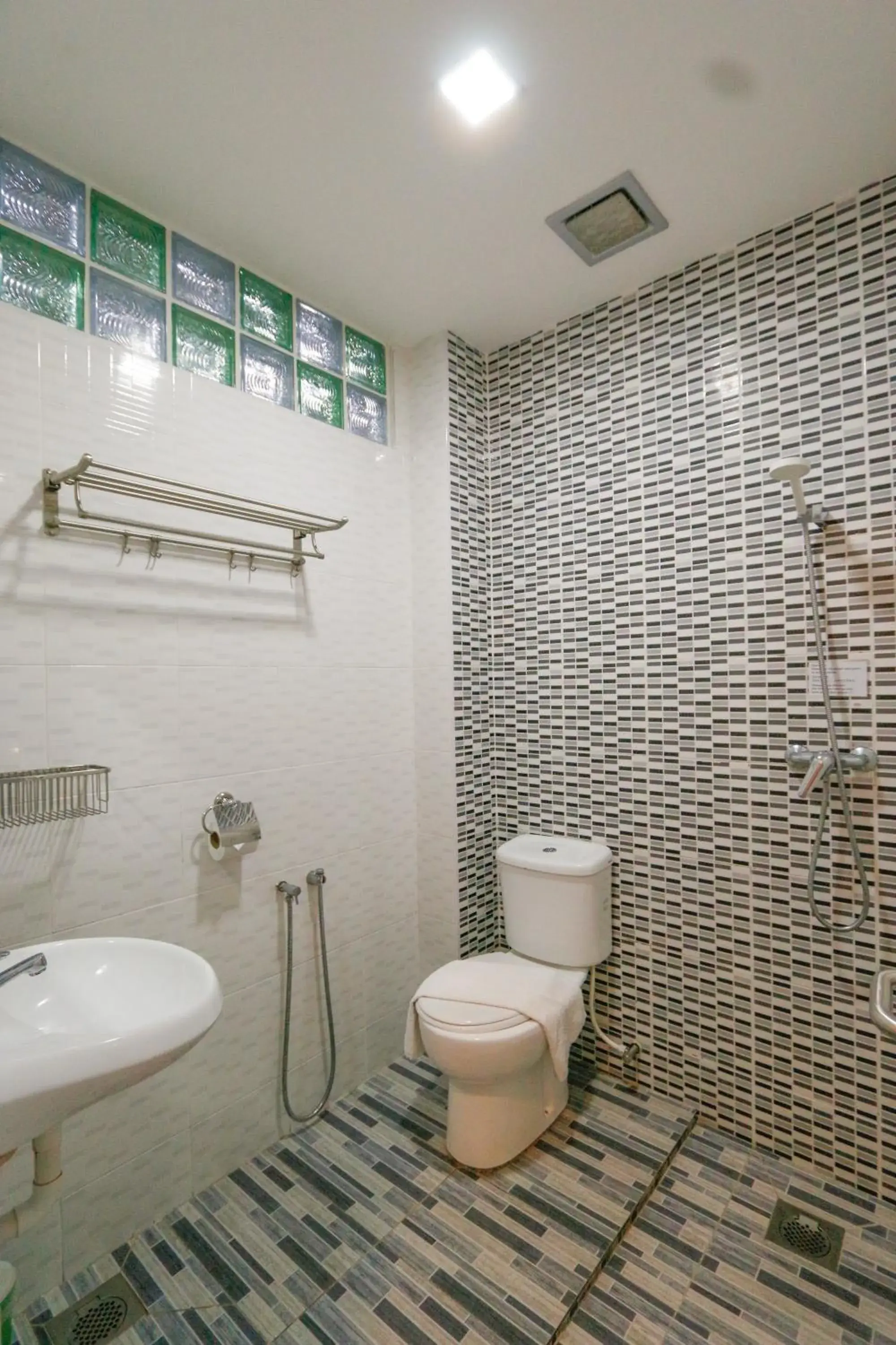 Shower, Bathroom in Travelland Hotel