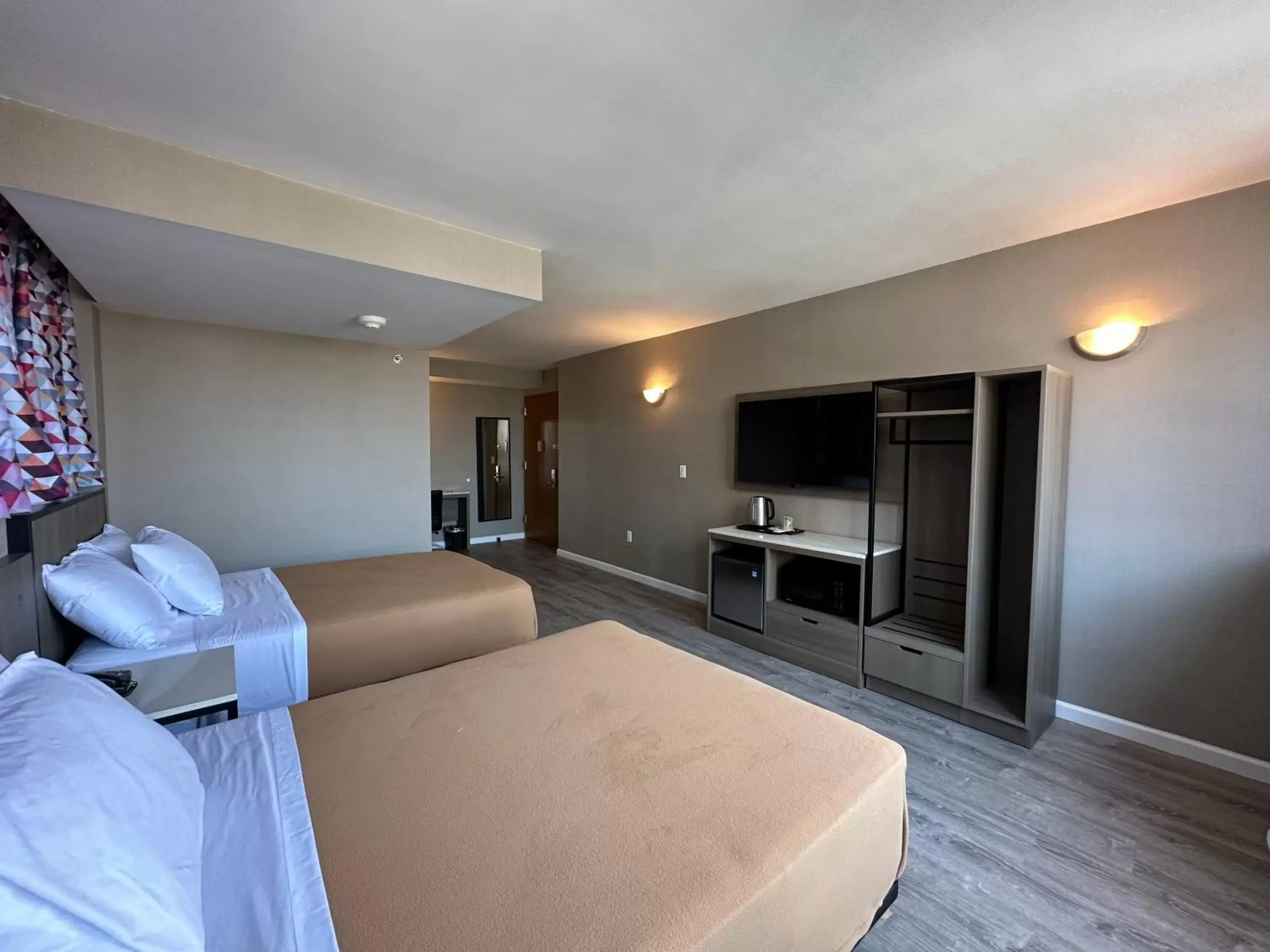 Bed in Regal Inn & Suites New York