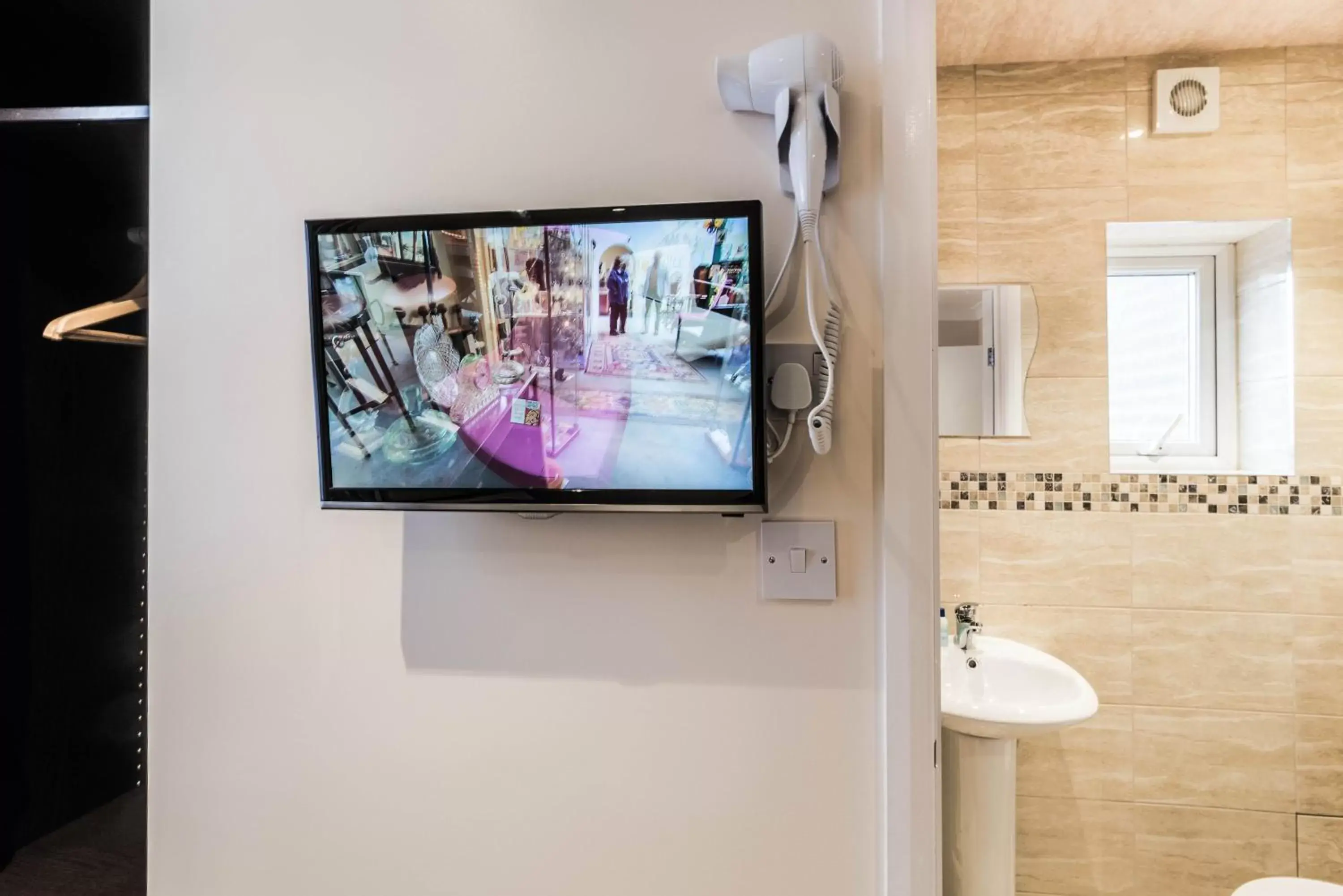 TV and multimedia, TV/Entertainment Center in Hellenic Hotel by Saba