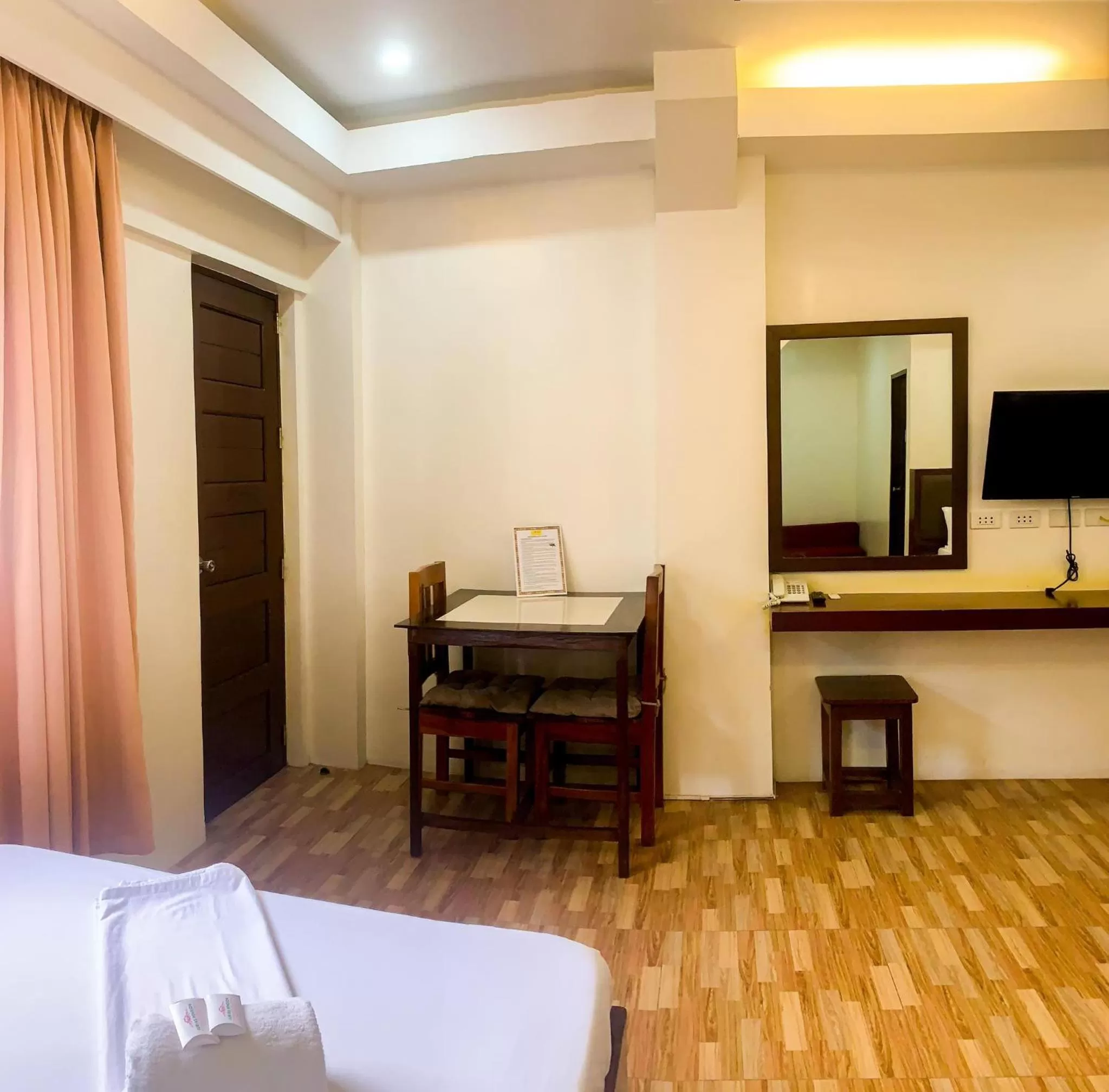 Seating area, Bed in Jurias Garden Hotel