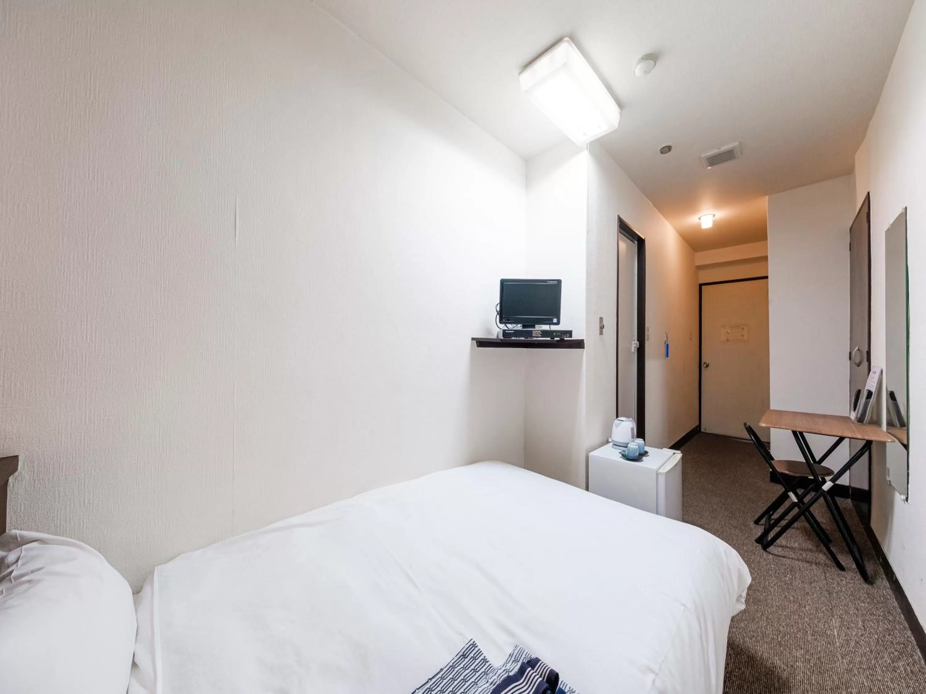 Bed in Tabist Hotel Tetora Hakodate Station